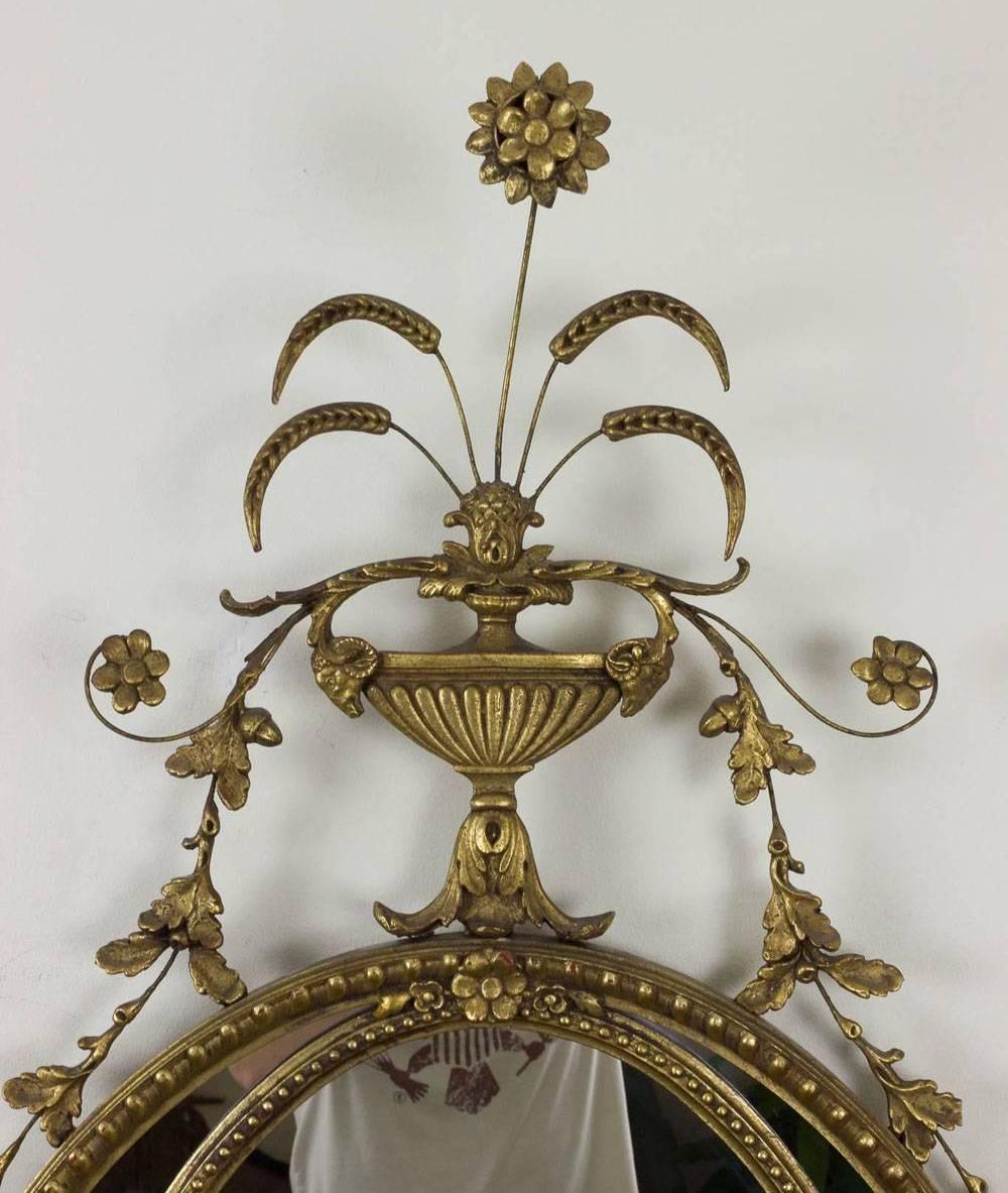 Highly decorated giltwood and gesso mirror with floral motif. 