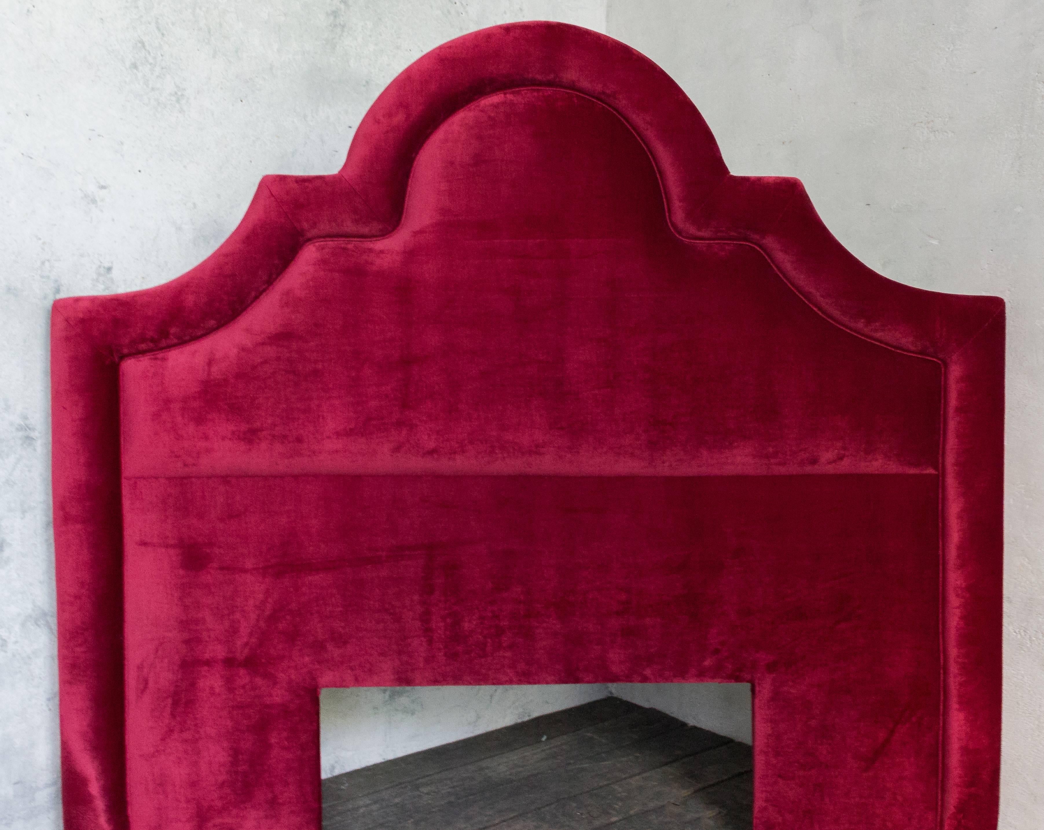 Beautiful scalloped red velvet head board. Will fit a queen-size bed.