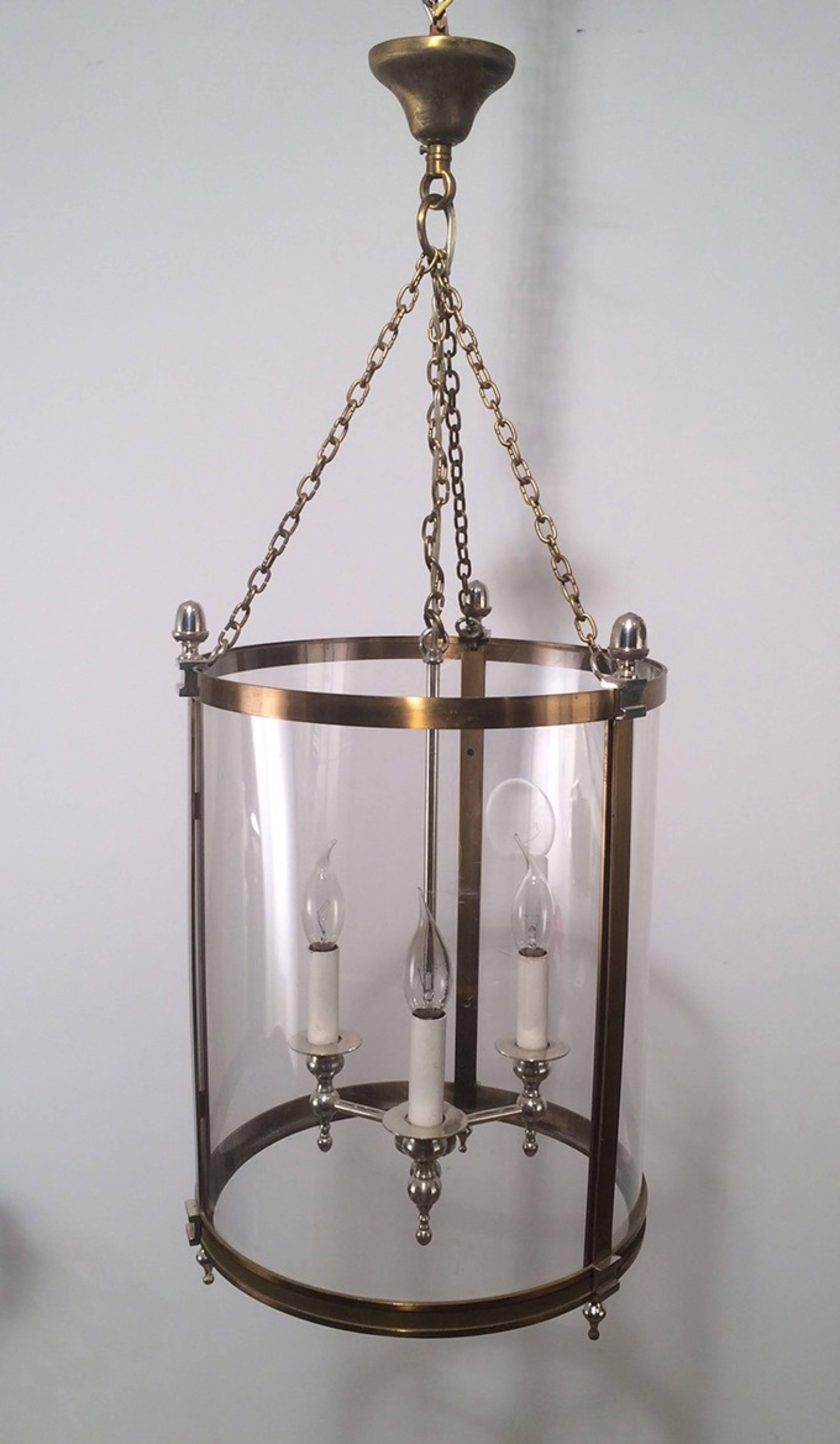 Neoclassical style brass and silver lantern with curved plastic faux-glass. 

This piece is currently in France, please allow 4 to 6 weeks for delivery. Shipping to our warehouse in Long Island City, New York is included in the price.