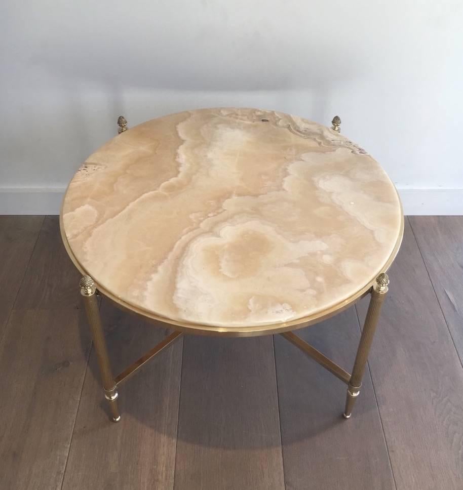 Round brass coffee table with fluted legs, pine cone finials and travertine top, French, circa 1940.


This item is currently in France, please allow 2 to 4 weeks delivery to New York. Shipping costs from France to our warehouse in New York
