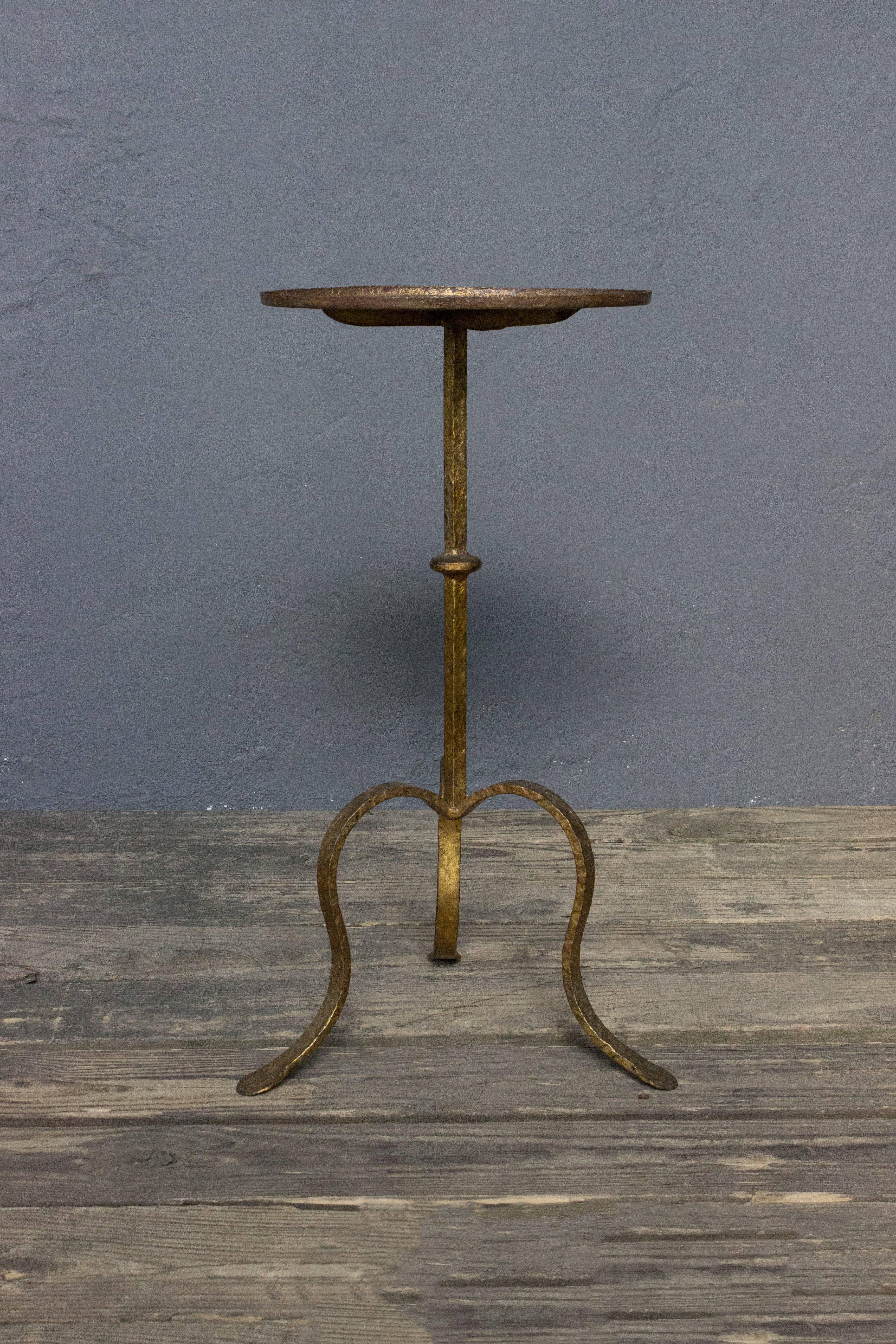 Gilt iron martini table with round hammered top.