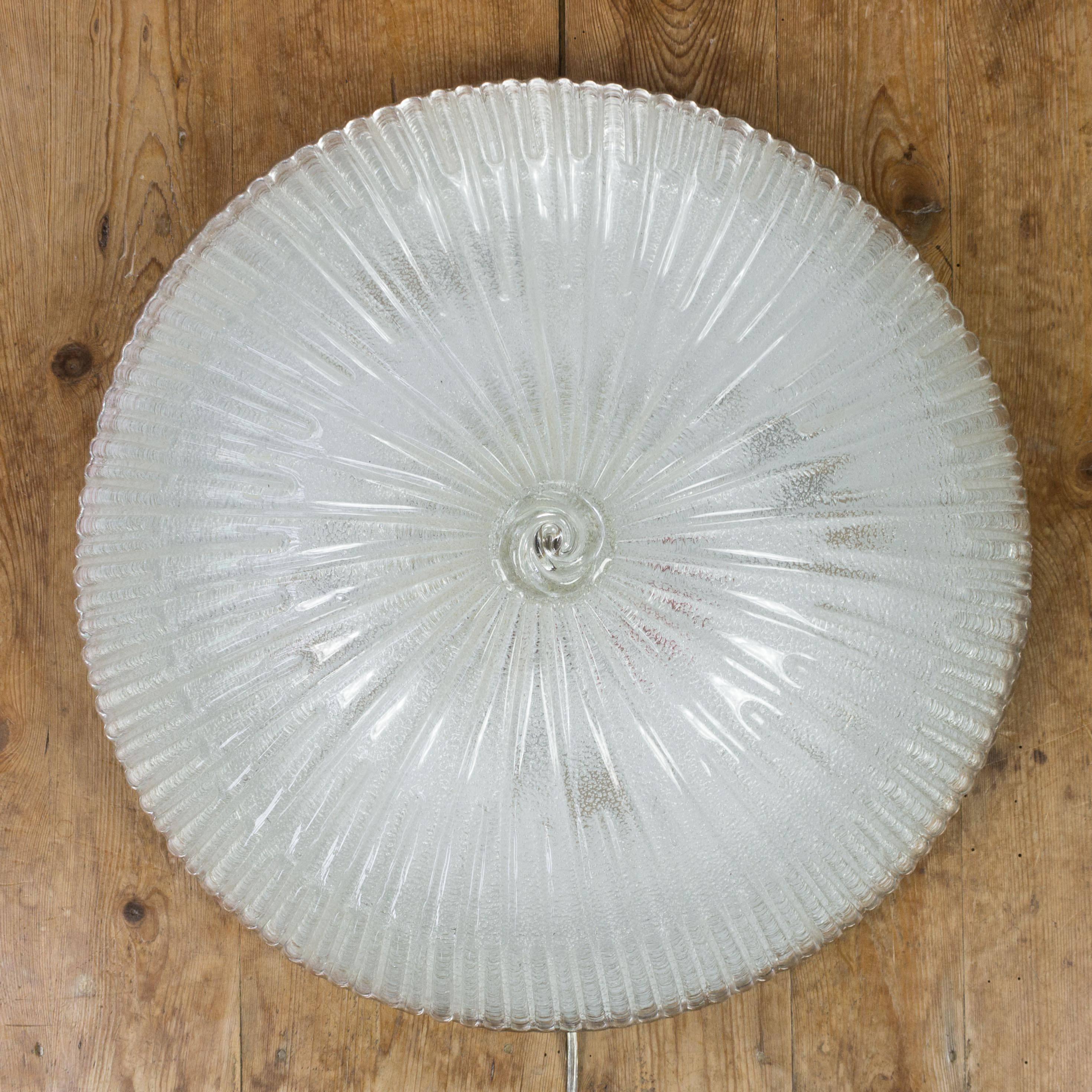 Pair of 1950s ribbed and textured glass fixtures with glass finials. The fixtures will be rewired to UL standards and refitted so they can be professionally installed and mounted on a metal frame with three lights.