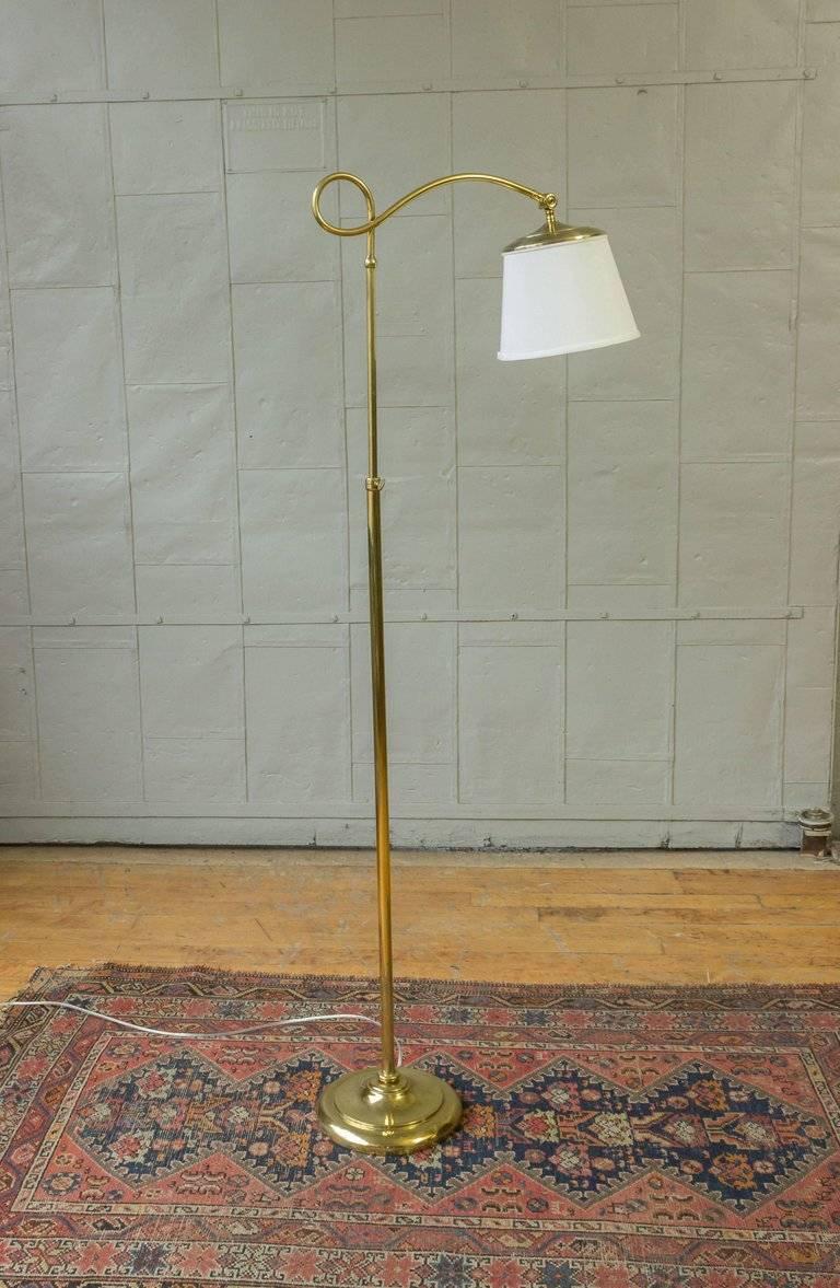 An interesting modern style brass floor lamp with a white linen-over paper shade. The lamp has recently been rewired and has a floor switch. The lamp can be adjusted in height.
We recommend using an LED bulb or an incandescent bulb that is no more