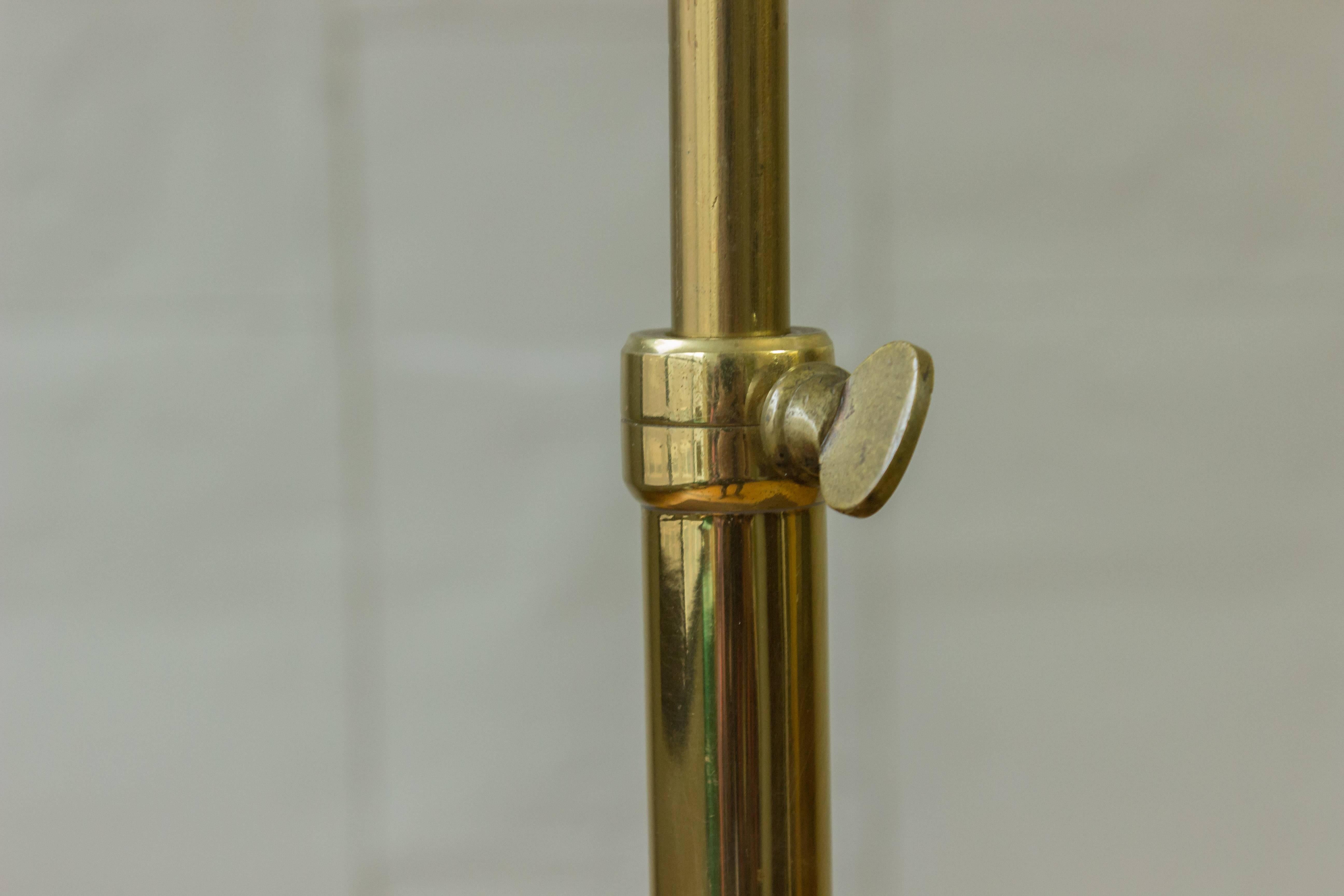 Adjustable Brass Reading Floor Lamp with a Round Base In Good Condition In Buchanan, NY