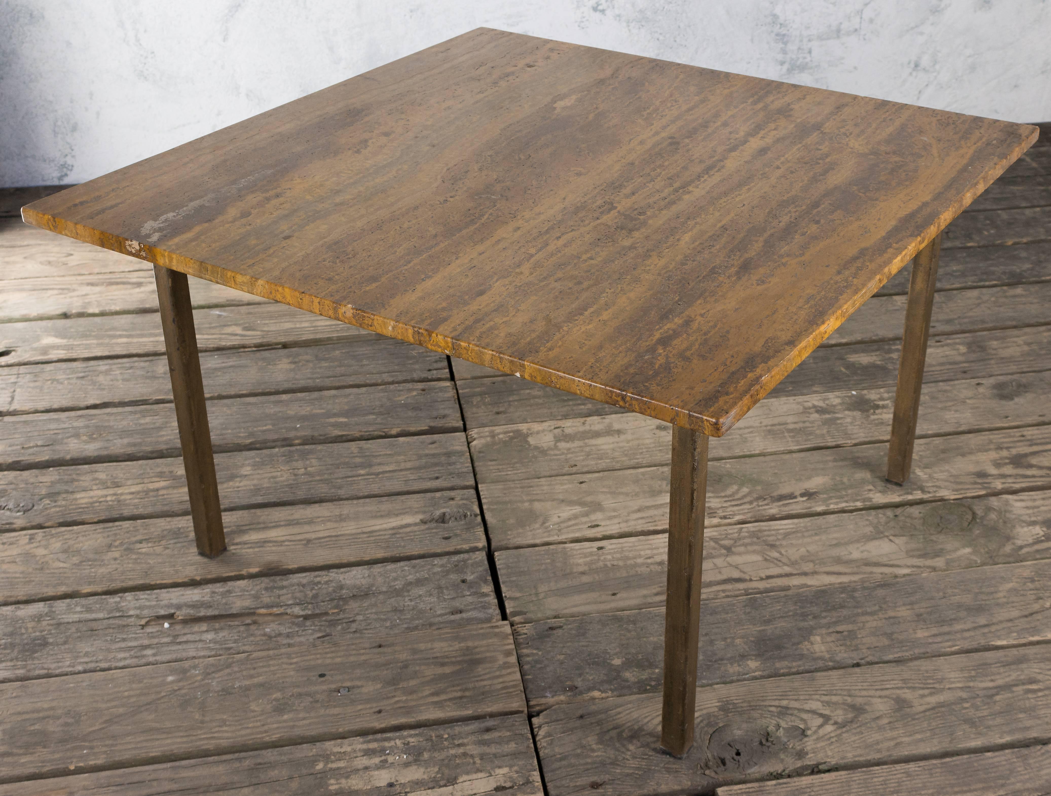 Gilt iron square coffee table with amber marble top.
French, 1980s.