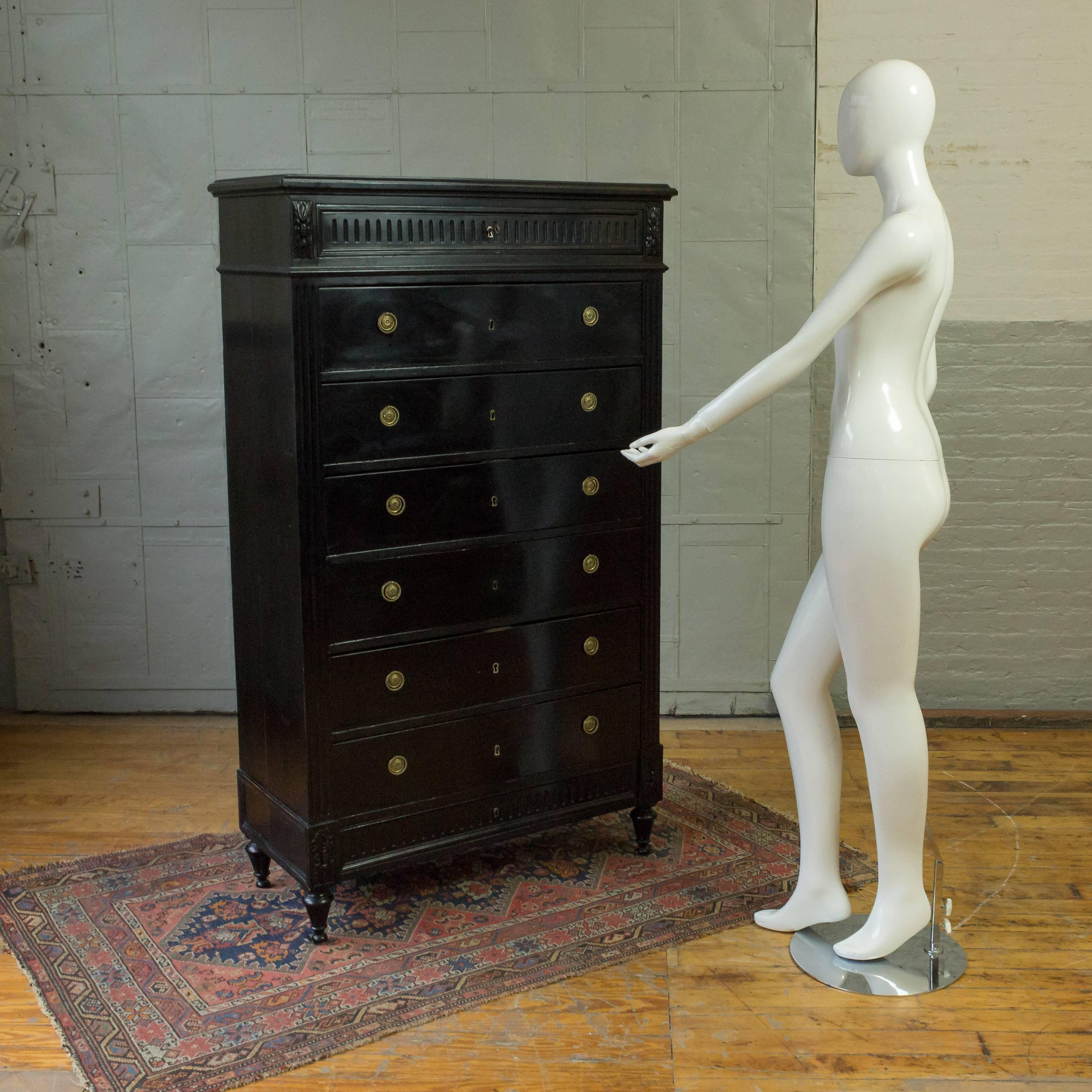 French Napoleon III ebonized high chest of drawers with original brass hardware.