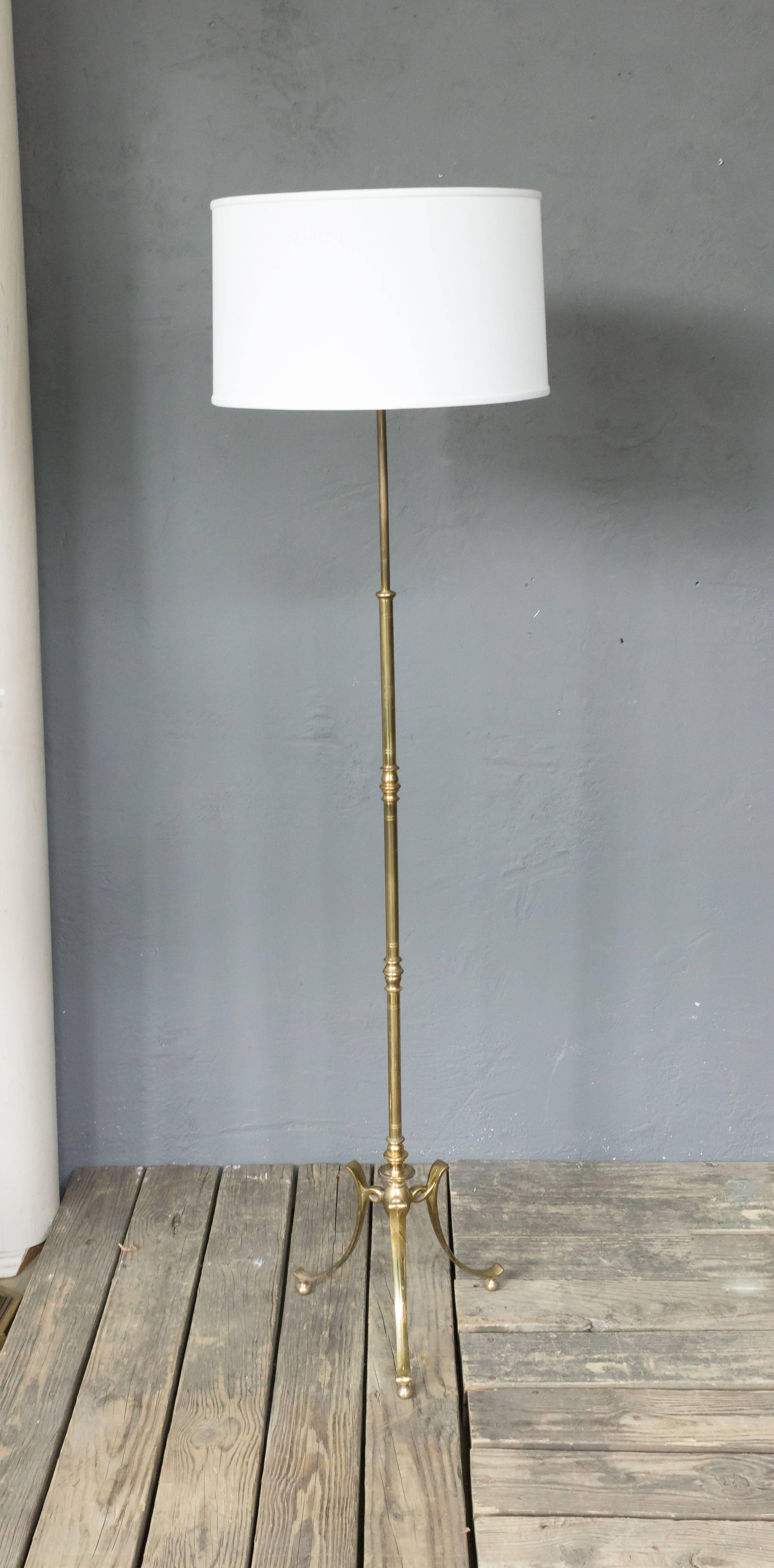 French 1950s brass floor lamp with tripod base. Recently rewired.

Not sold with shade.