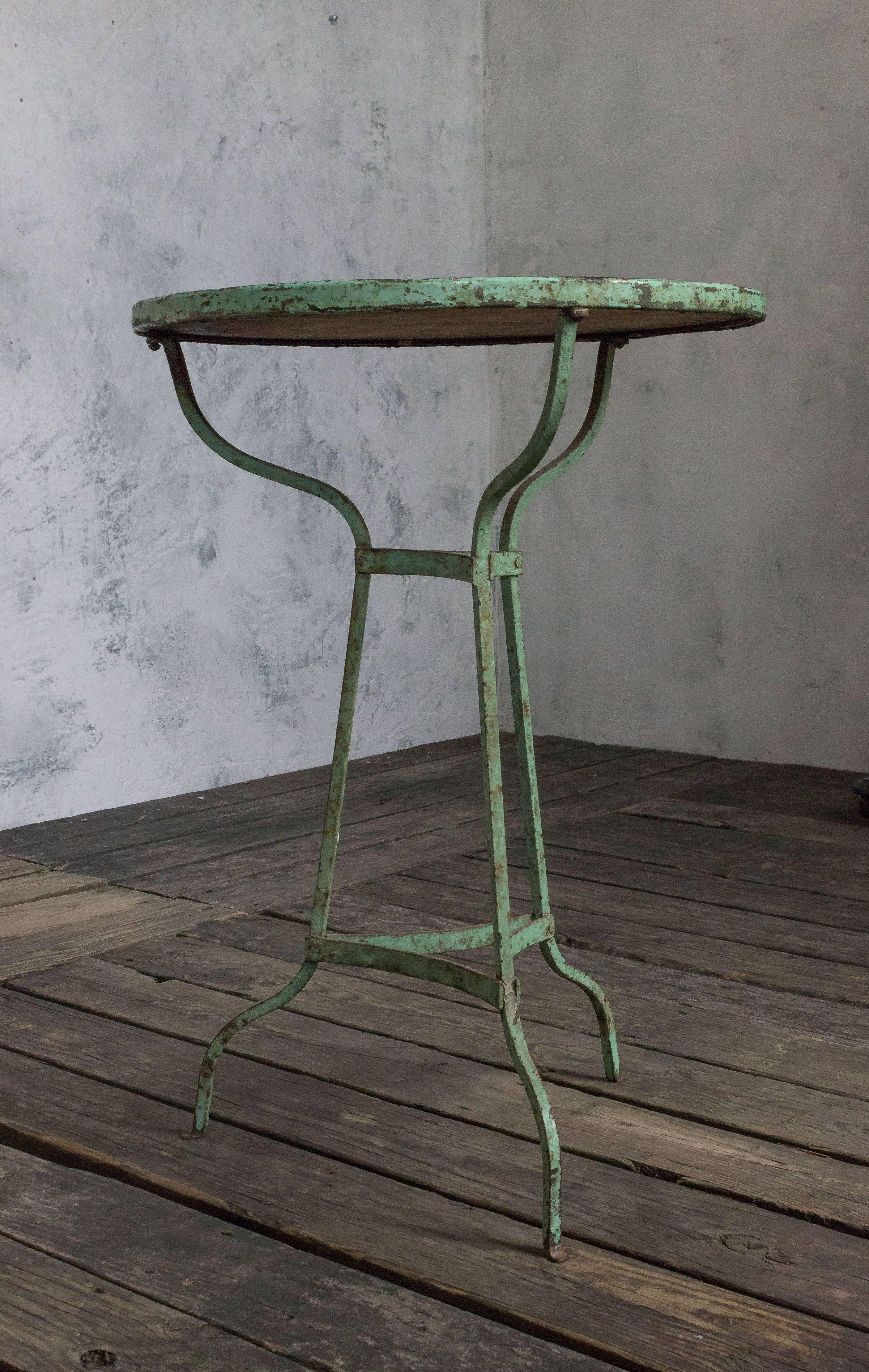 Small green garden table with white marble top, French, 1920s.
 