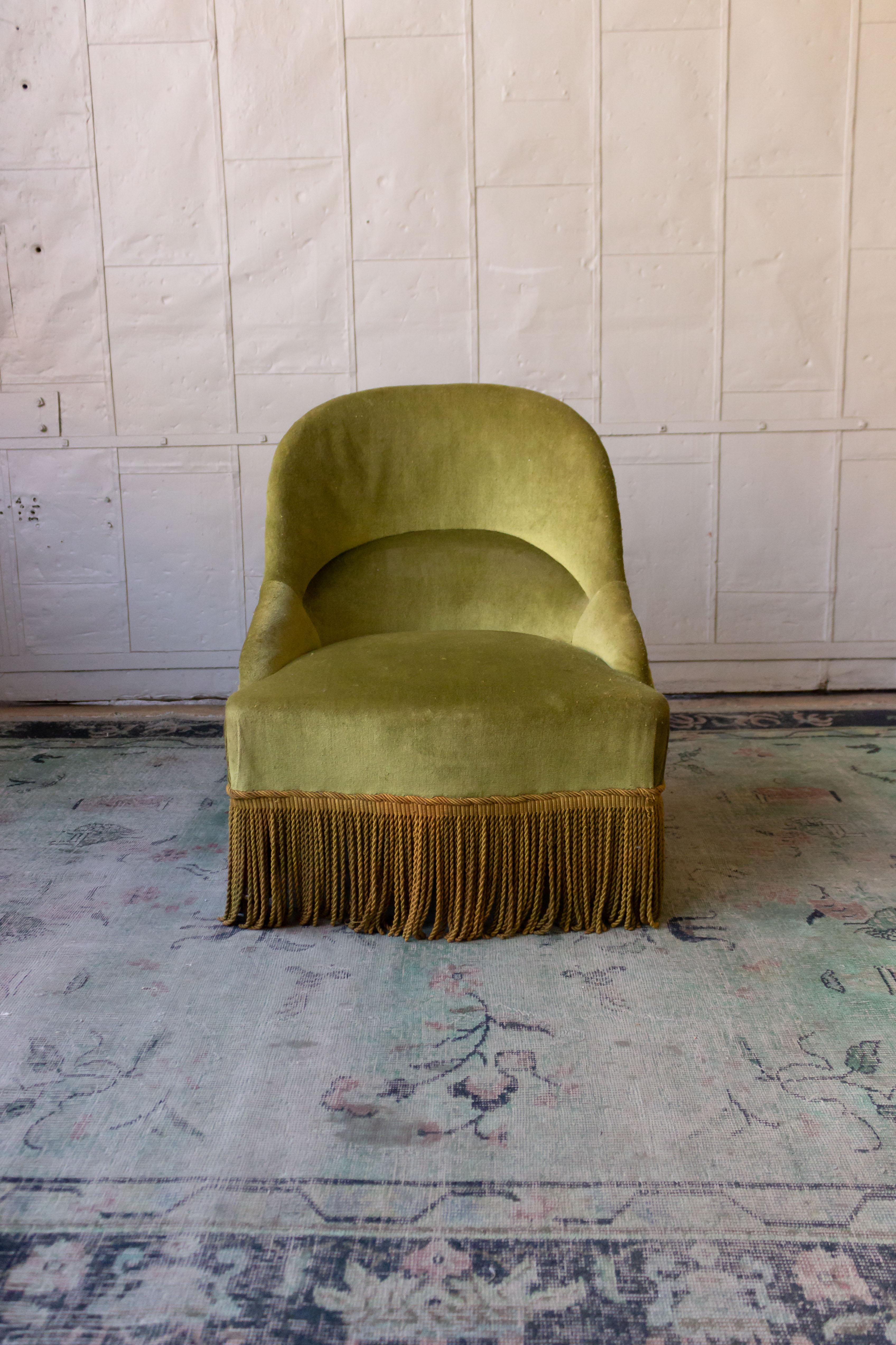 Pair of Napoleon III style slipper chairs in green velvet with contrasting bullion fringe, French, early 20th century. Sold as is.