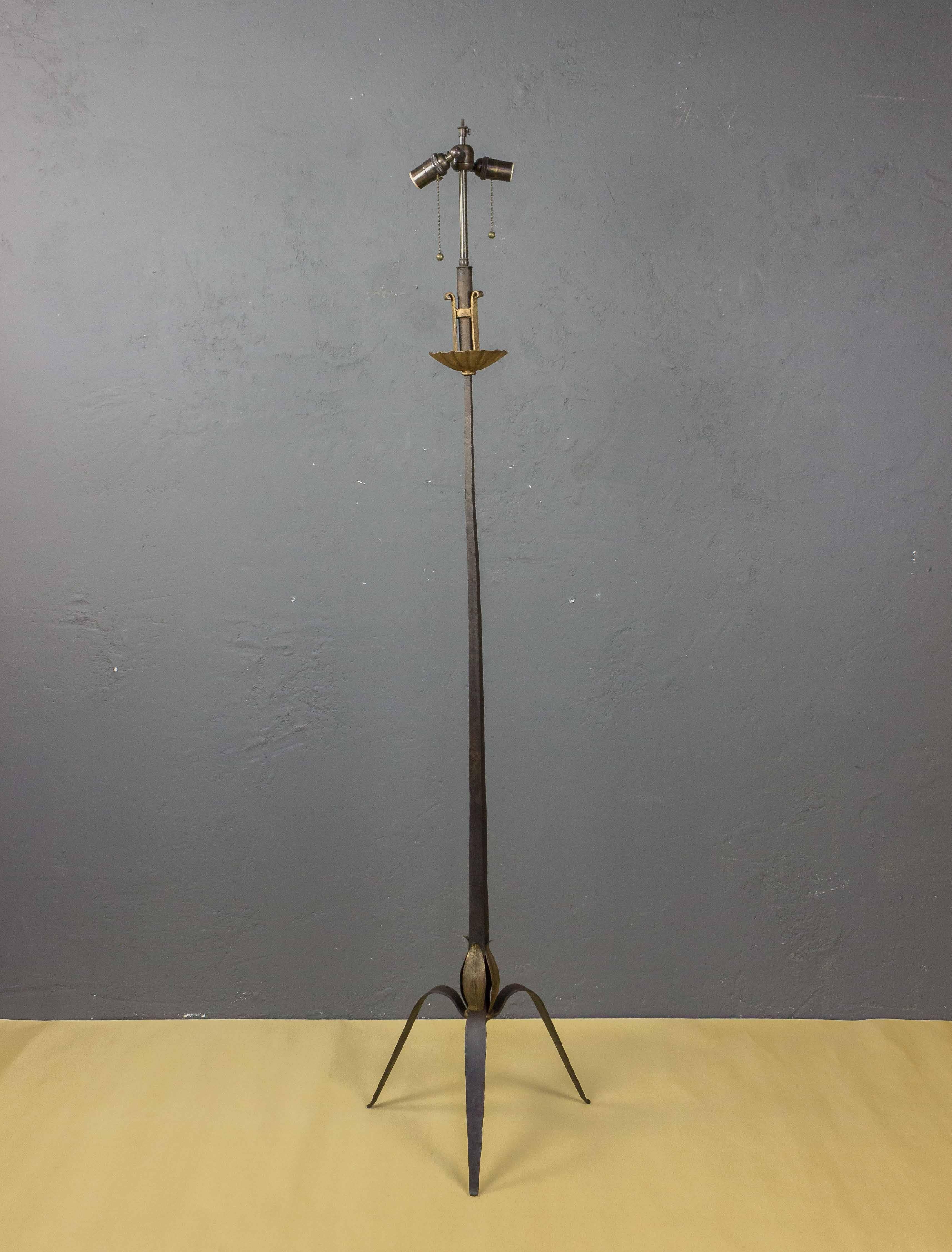 Art Deco style French floor lamp on a tripod base with a slender stem with gilt leaves at the bottom. The cluster lighting sockets are mounted on a gilt bobeche. The lamp has recently been wired (UL code wiring available by quote on request). Not