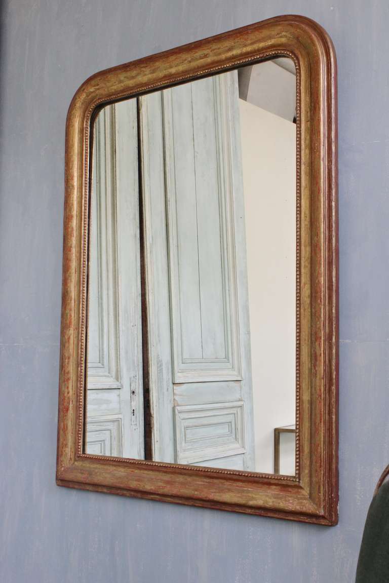 French 19th century Louis-Phillipe giltwood framed mirror with original mirror.