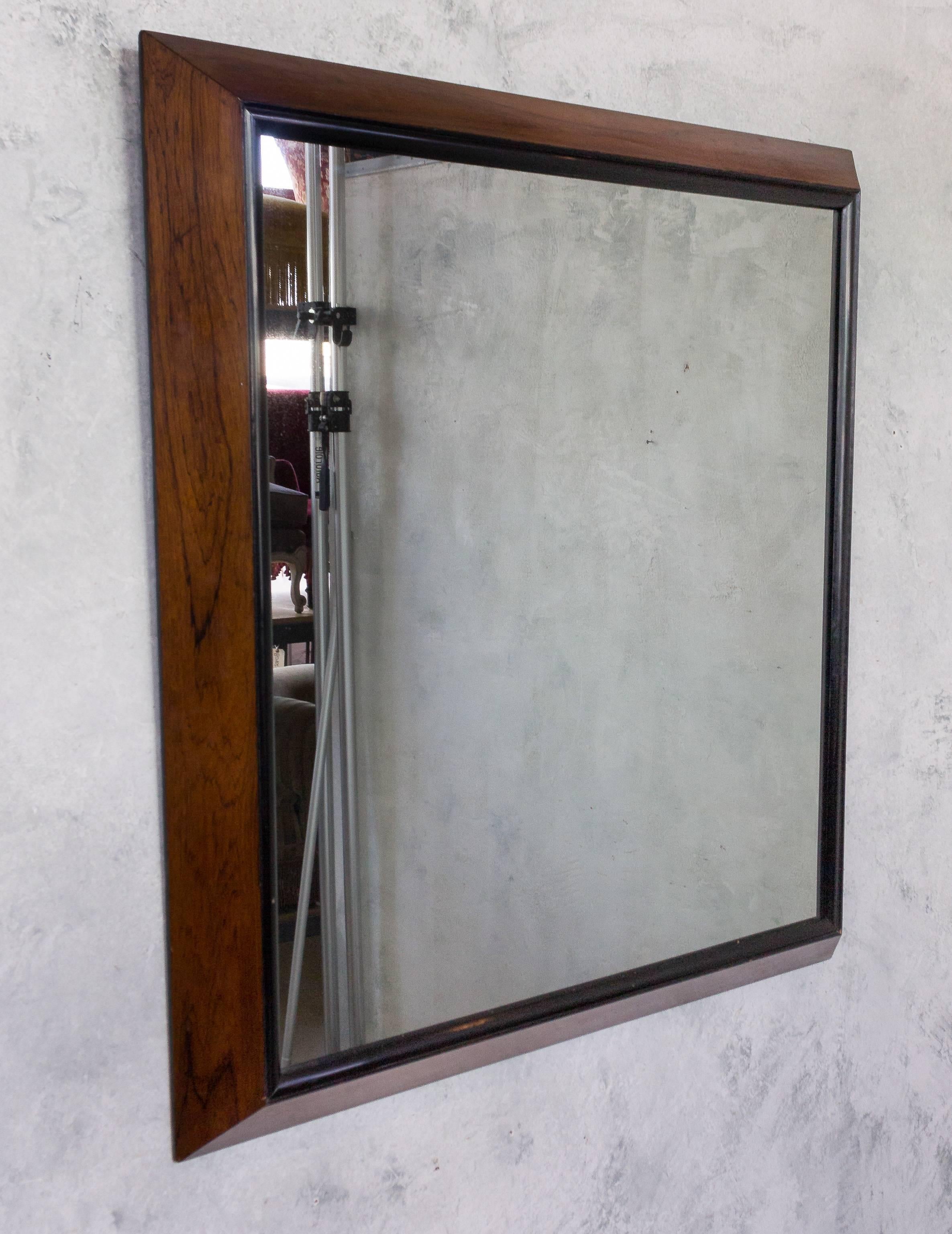 Large rosewood framed mirror with ebonized trim.