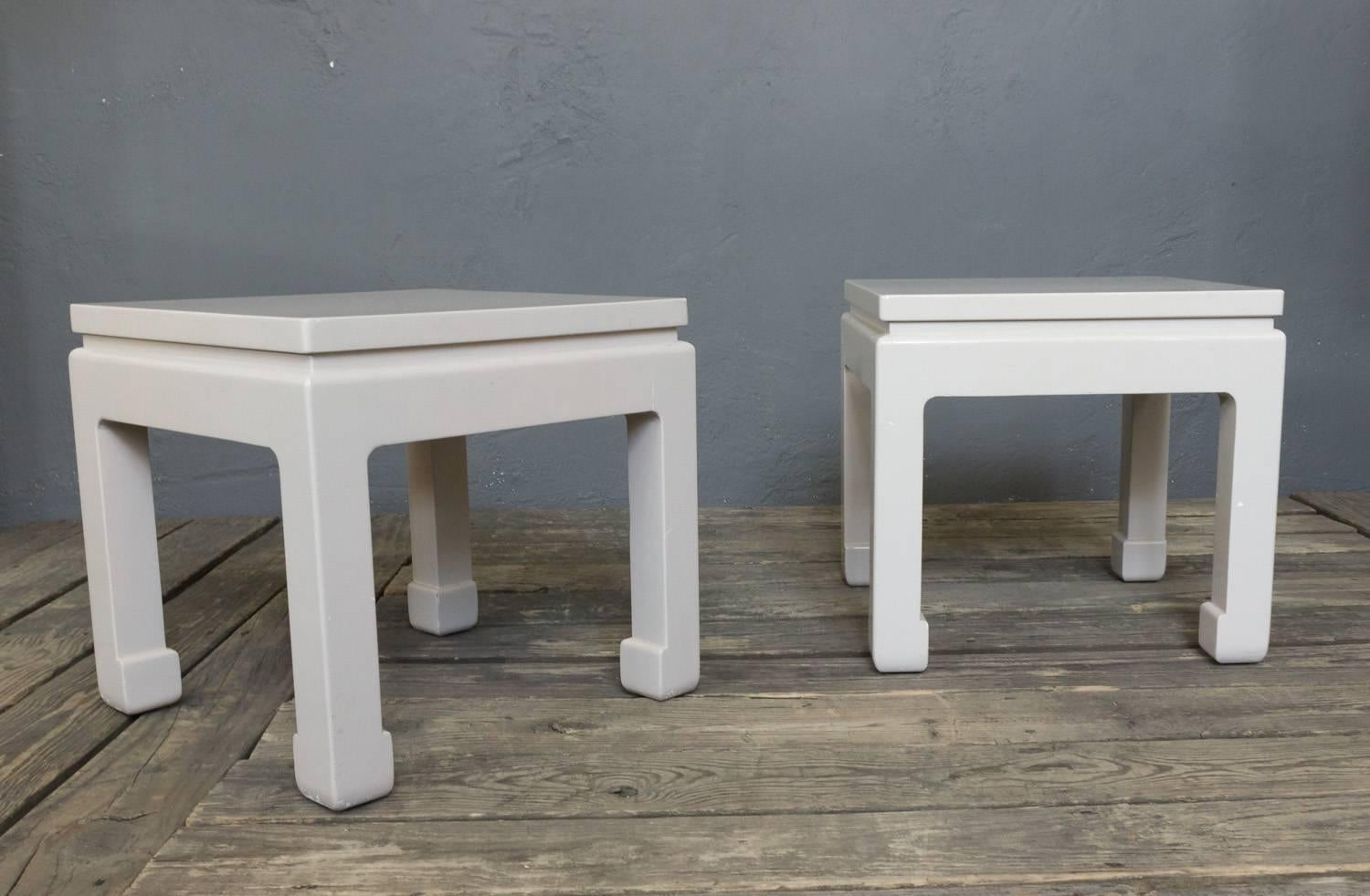 Pair of midcentury white lacquered end tables. Scratches and minor loss to finish.