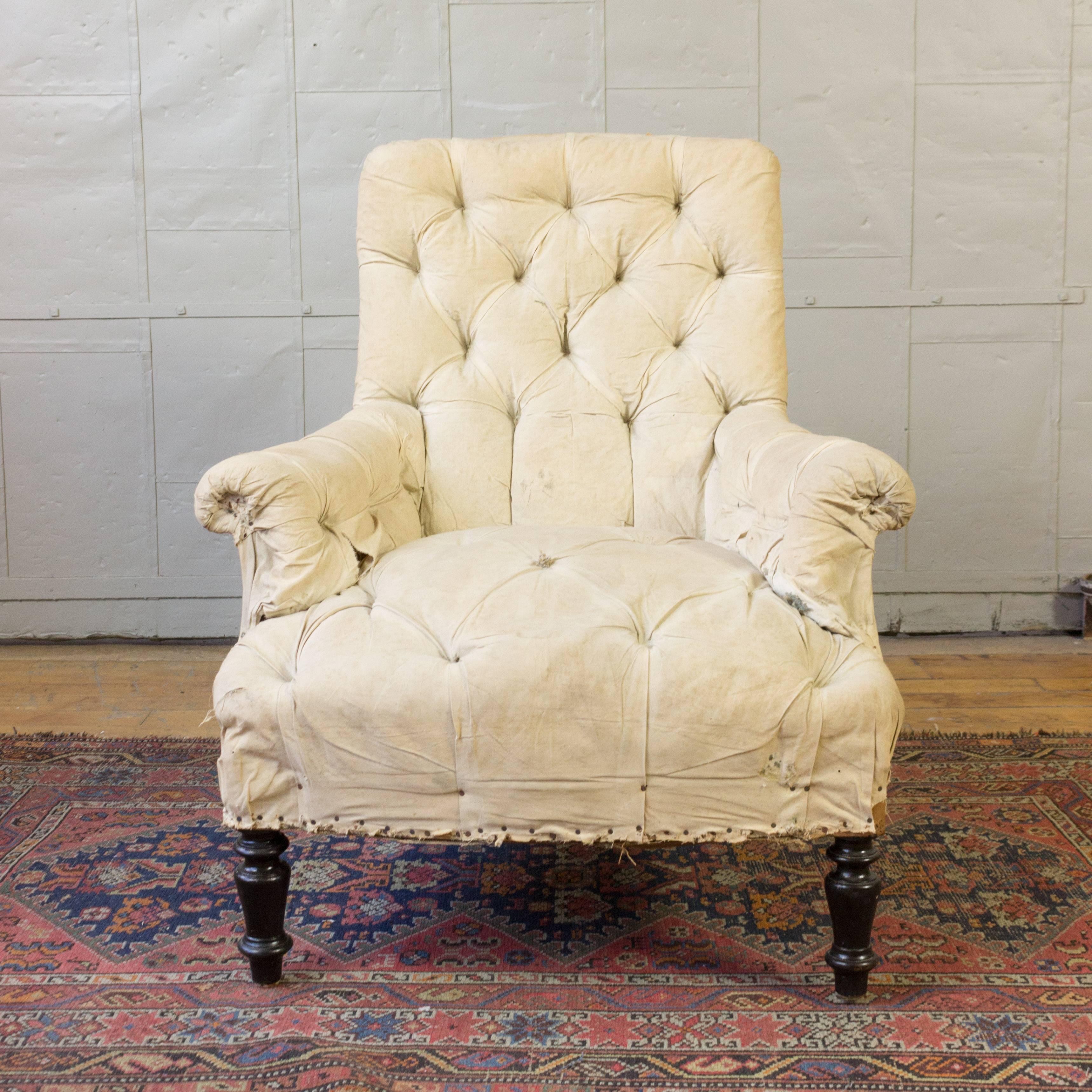 This is a single Napoleon III armchair with heavy tufting, rolled arms and a high back. Please contact for upholstery option.