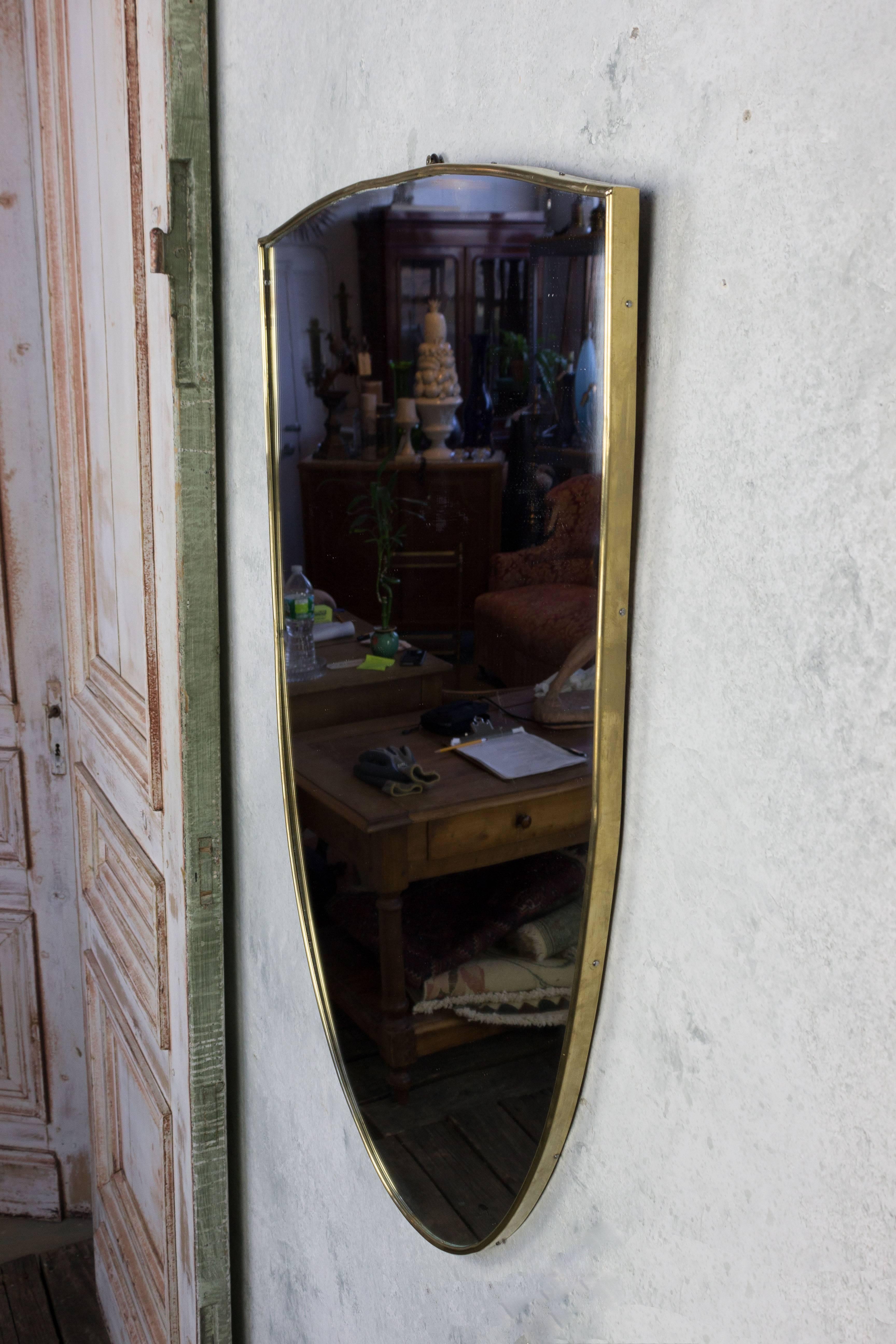 Pair of shield shaped mirrors in a clean brass frame, Italian, circa 1960. Very good vintage condition. Possible to split the pair at $1,200 each.

Ref#: DM0215-15

Dimensions: 33”H x 21.25