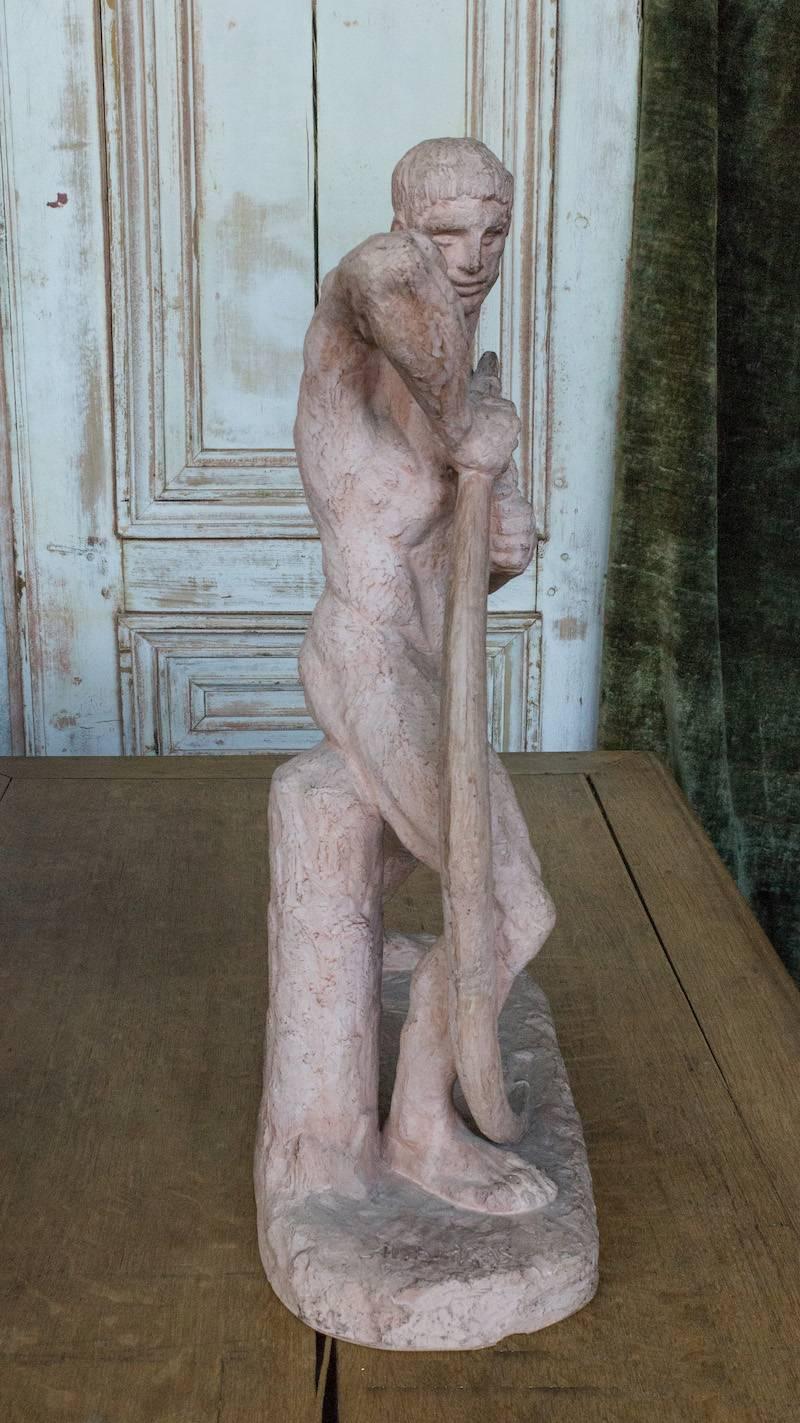 French, 1930s Art Deco sculpture representing a male nude bending a bow, signed Bargas. Plaster with a terracotta finish. Signed H. Bargas.