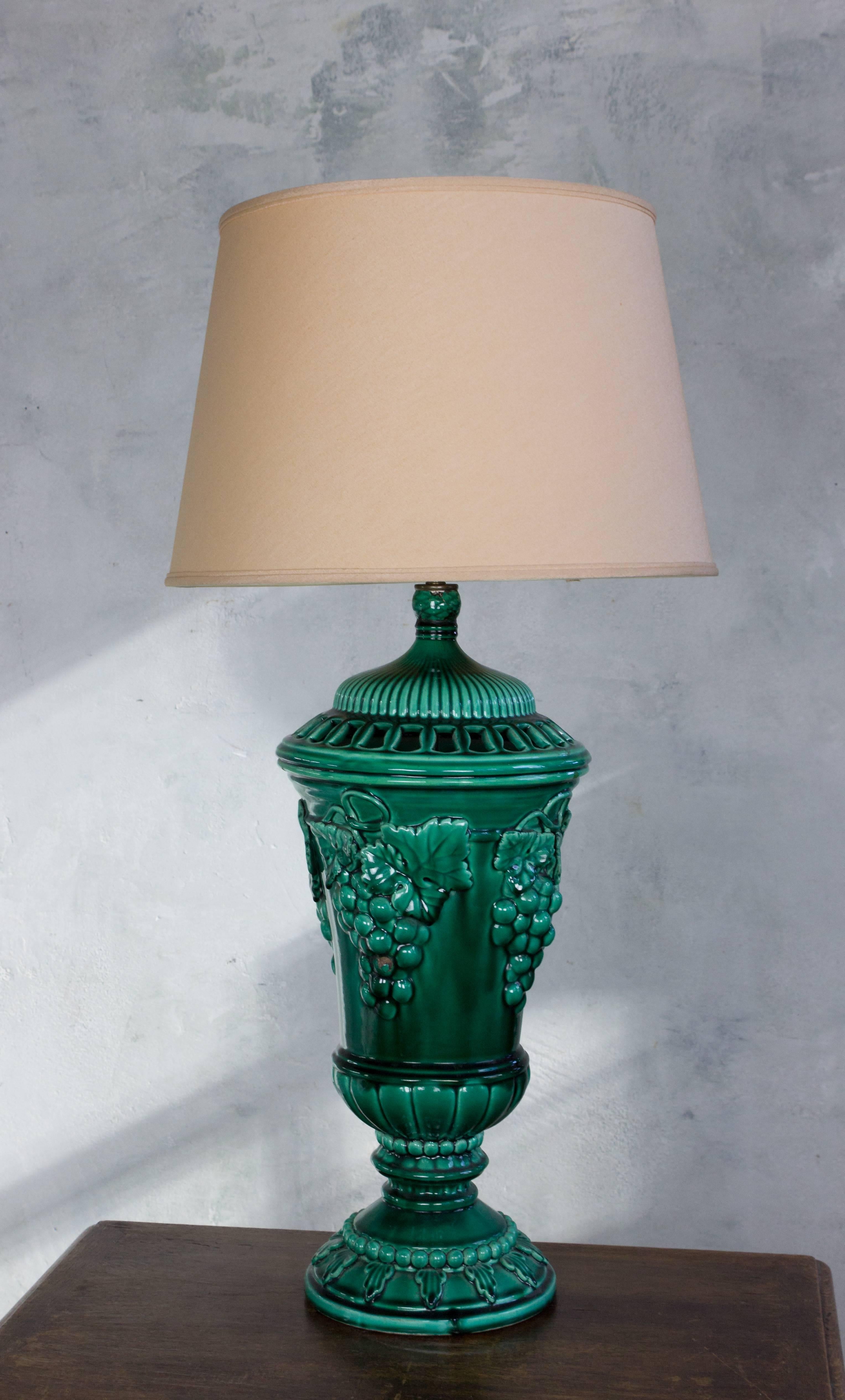 Very large green ceramic table lamp with grape and vine design, Spanish, 1950s. 
Shade not included.