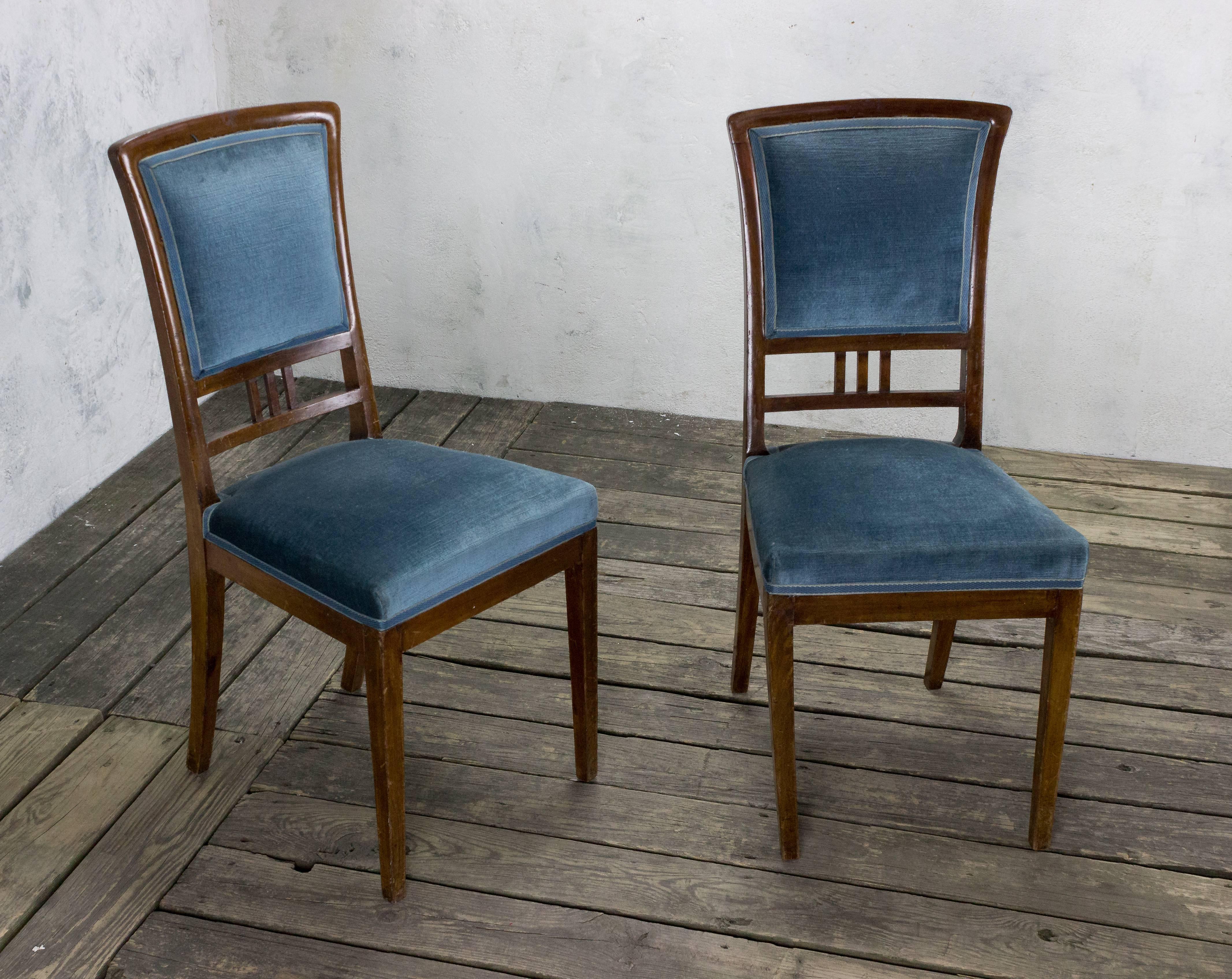 Pair of mahogany dining chairs upholstered in light blue velvet. Sold as is. Restoration and upholstery services available upon request.