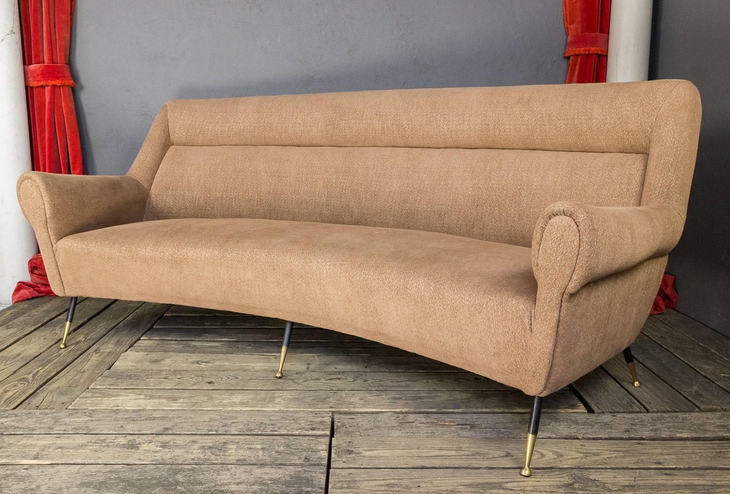 Unusual sofa with gracious curved back and newly upholstered in a beige chenille fabric. Attributed to Minotti.

RENTAL ONLY INVENTORY PIECE, NOT FOR SALE.

          