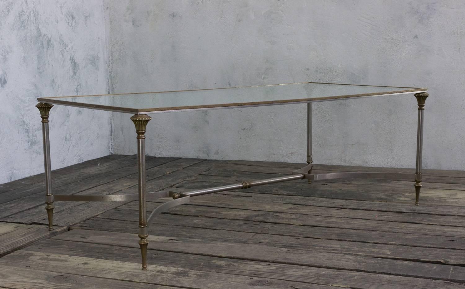 European coffee table with new glass top. The base is made of steel with brass accents with round legs and brass feet. Most likely made in Italy or France, circa 1950s.

Ref #: CT0210-02

Dimensions: 17