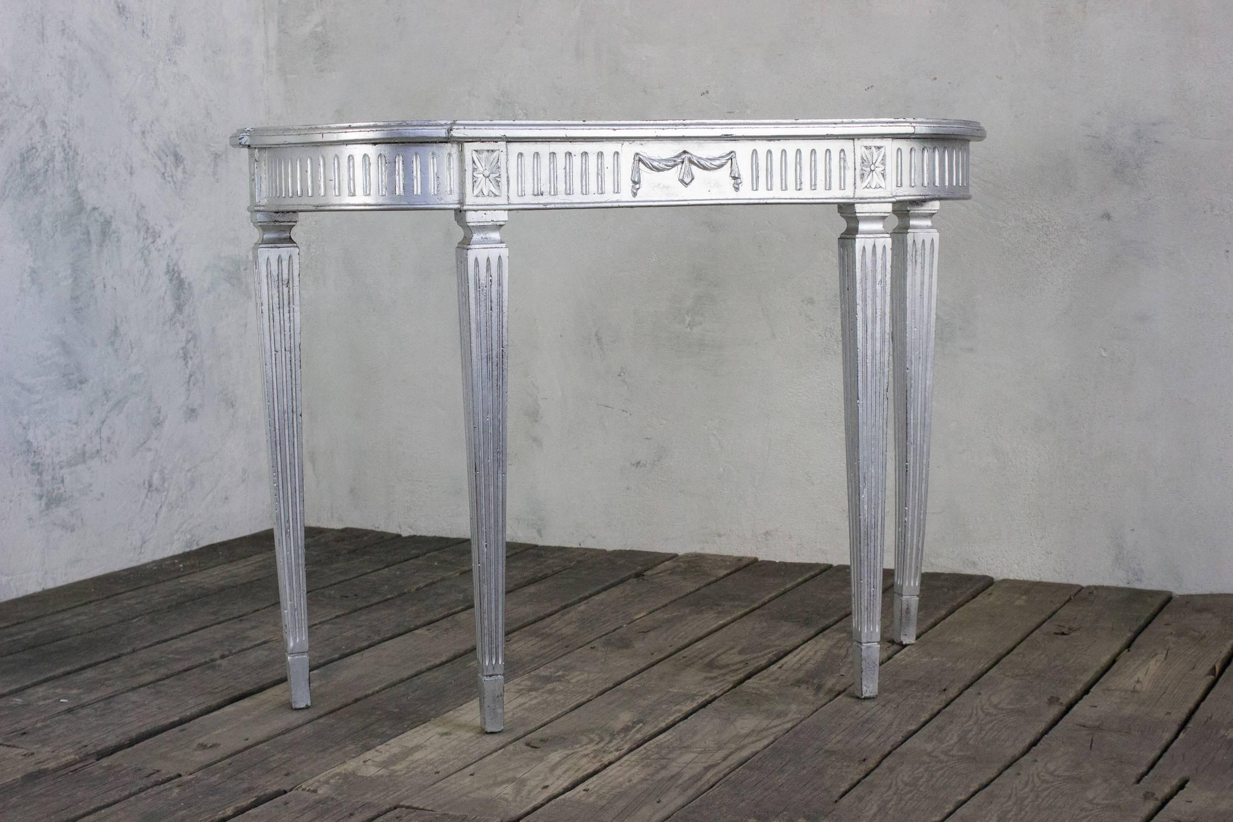 French wood console, circa 1940s with a silver paint finish.
