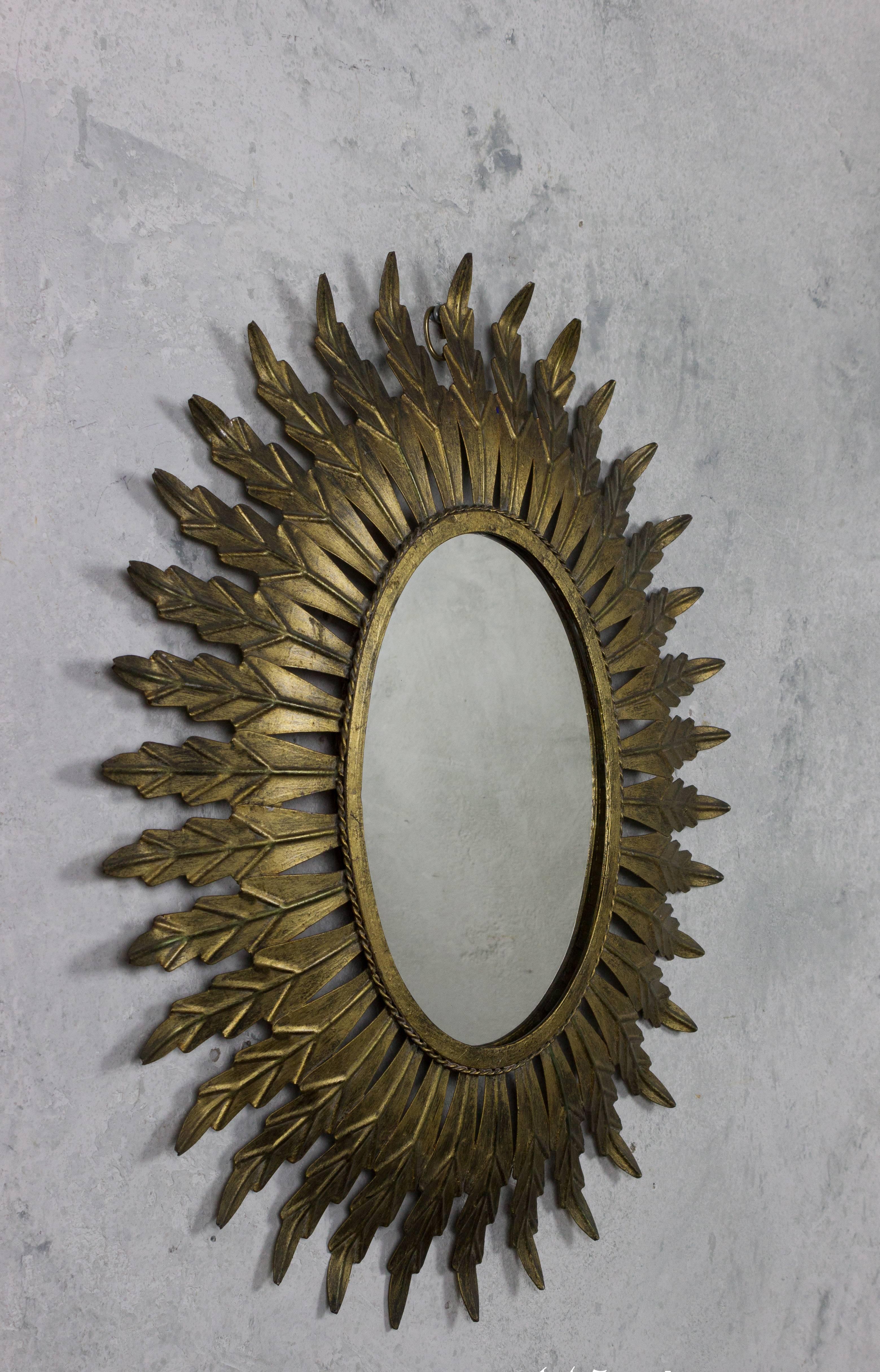 Gilt Metal Oval Sunburst Mirror In Excellent Condition In Buchanan, NY