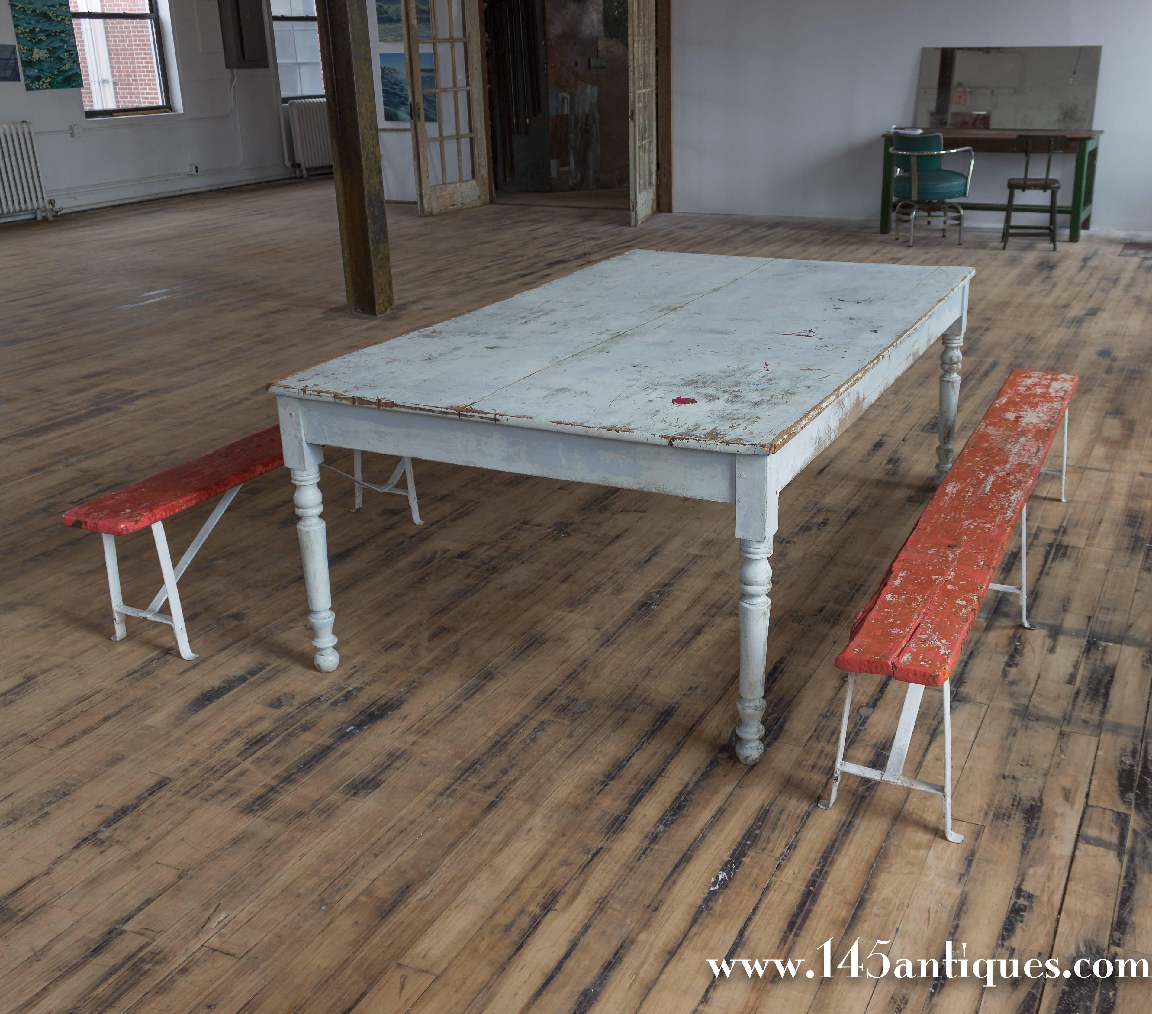 Distressed finished dining or draper's table with single center draw, French, early 20th century.