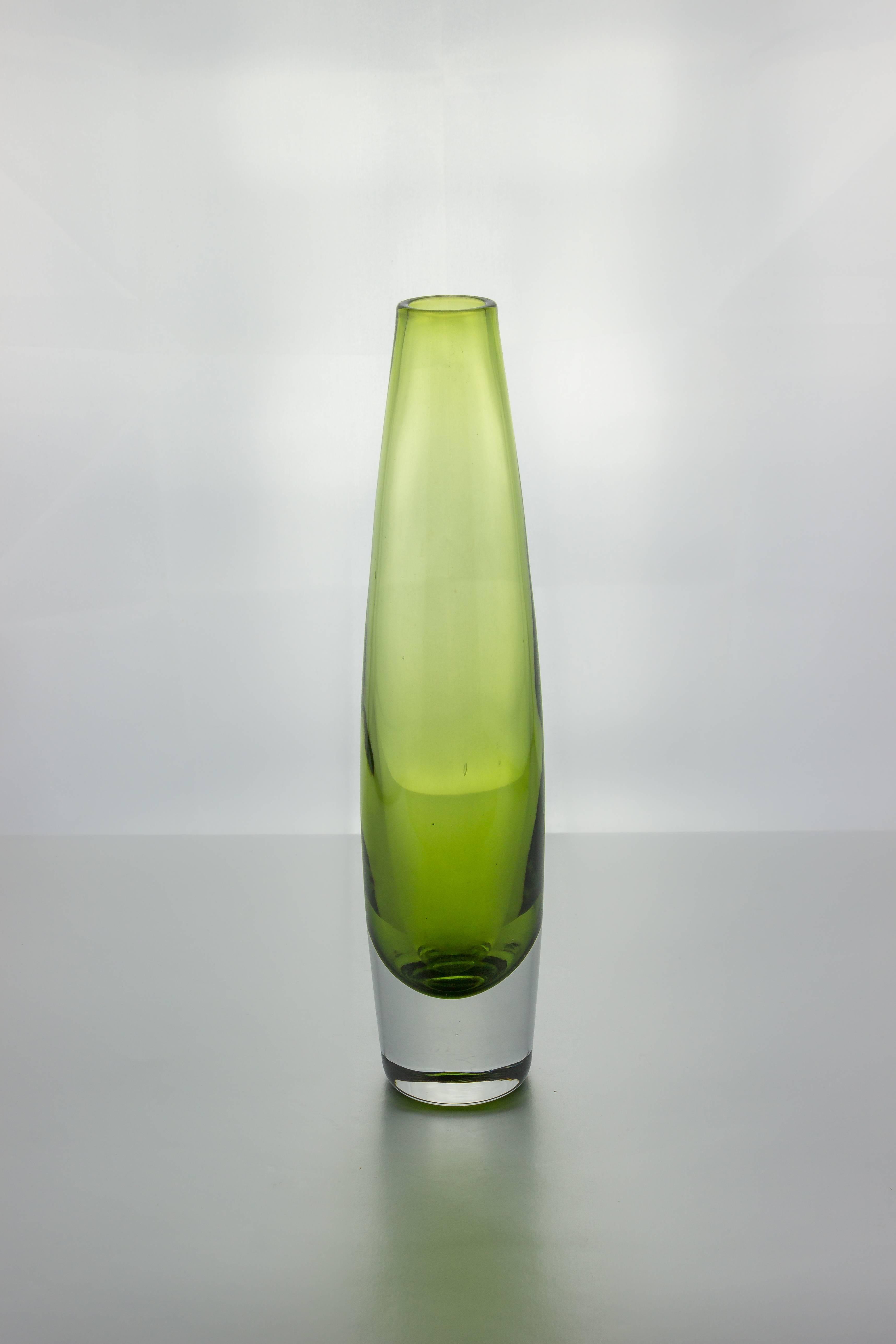 Modern light green crystal bud vase with clear base. Probably of Swedish origin.