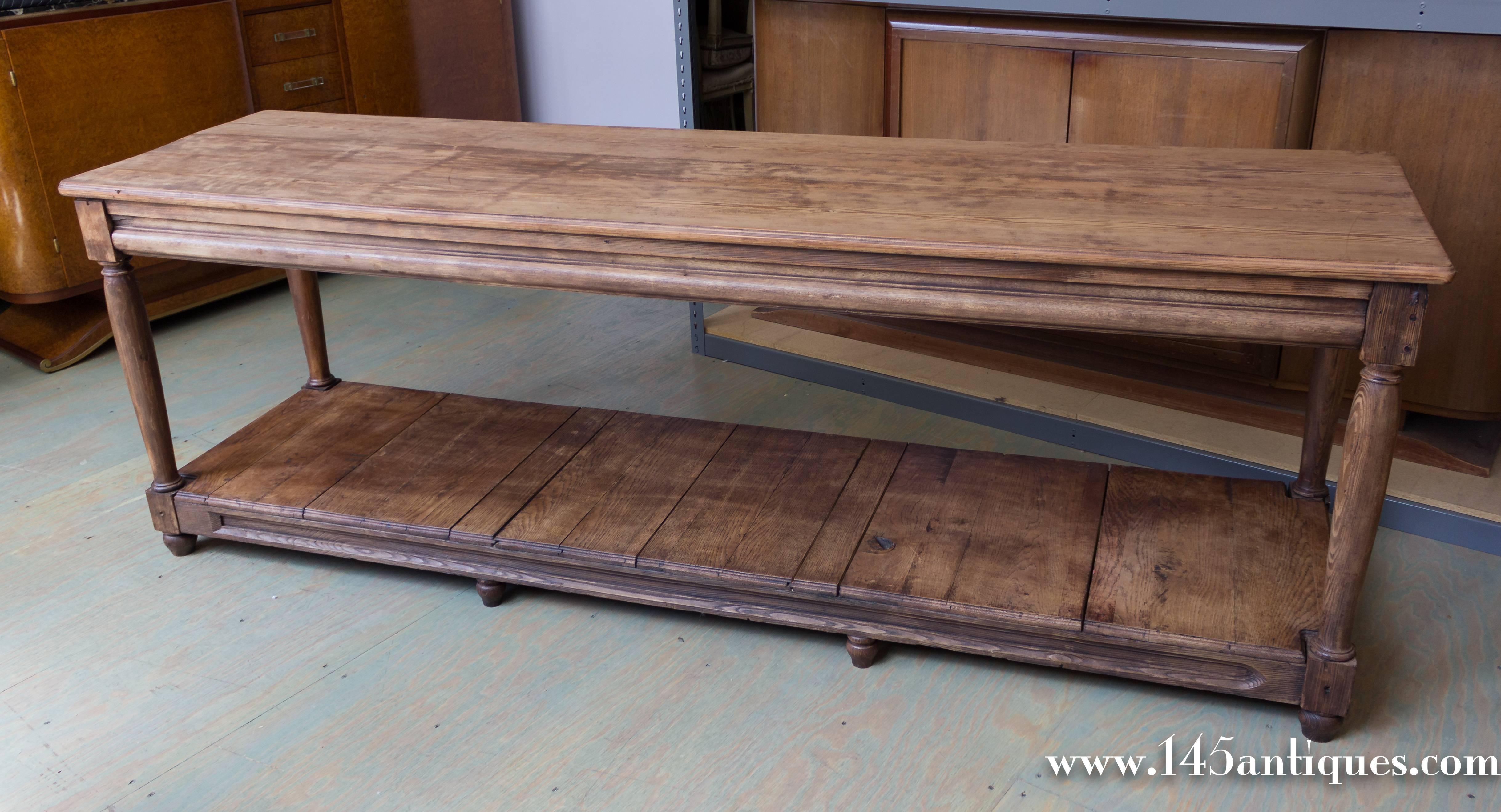 Large solid wood pine draper's table with tongue and groove jointed bottom shelf.