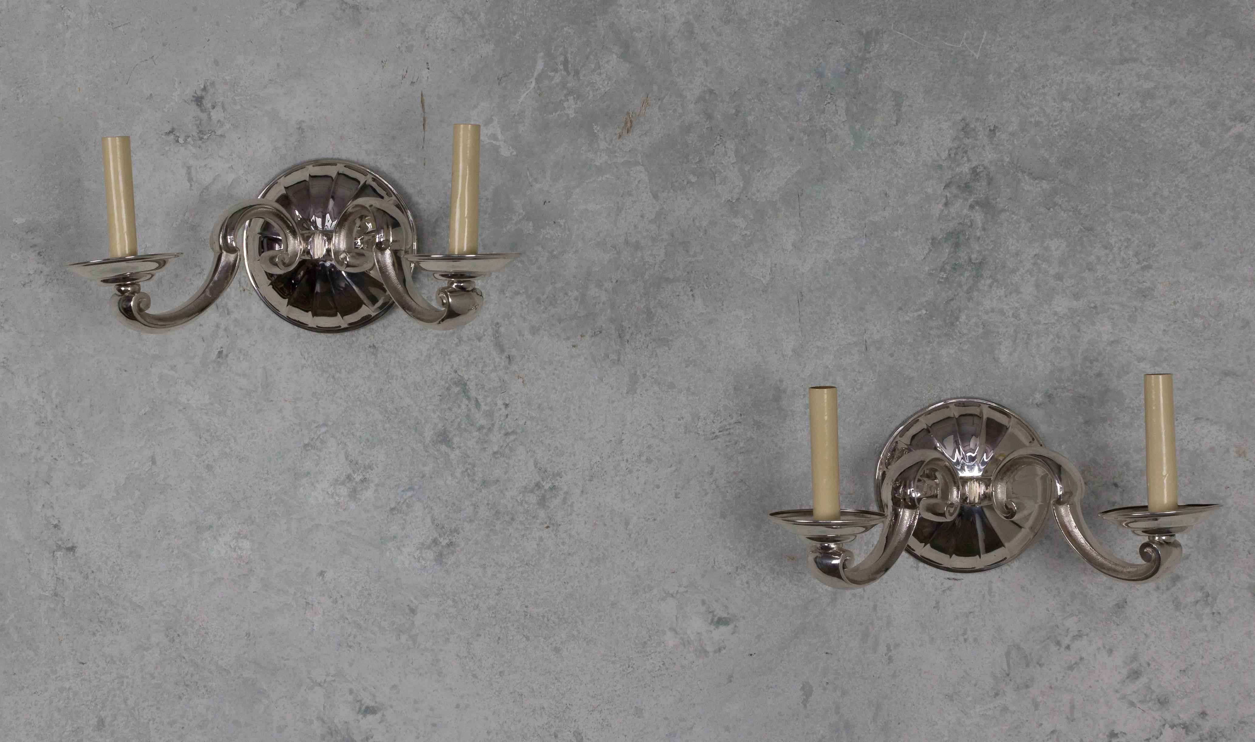 Pair of French 1940's nickel-plated bronze wall sconces with two arms.