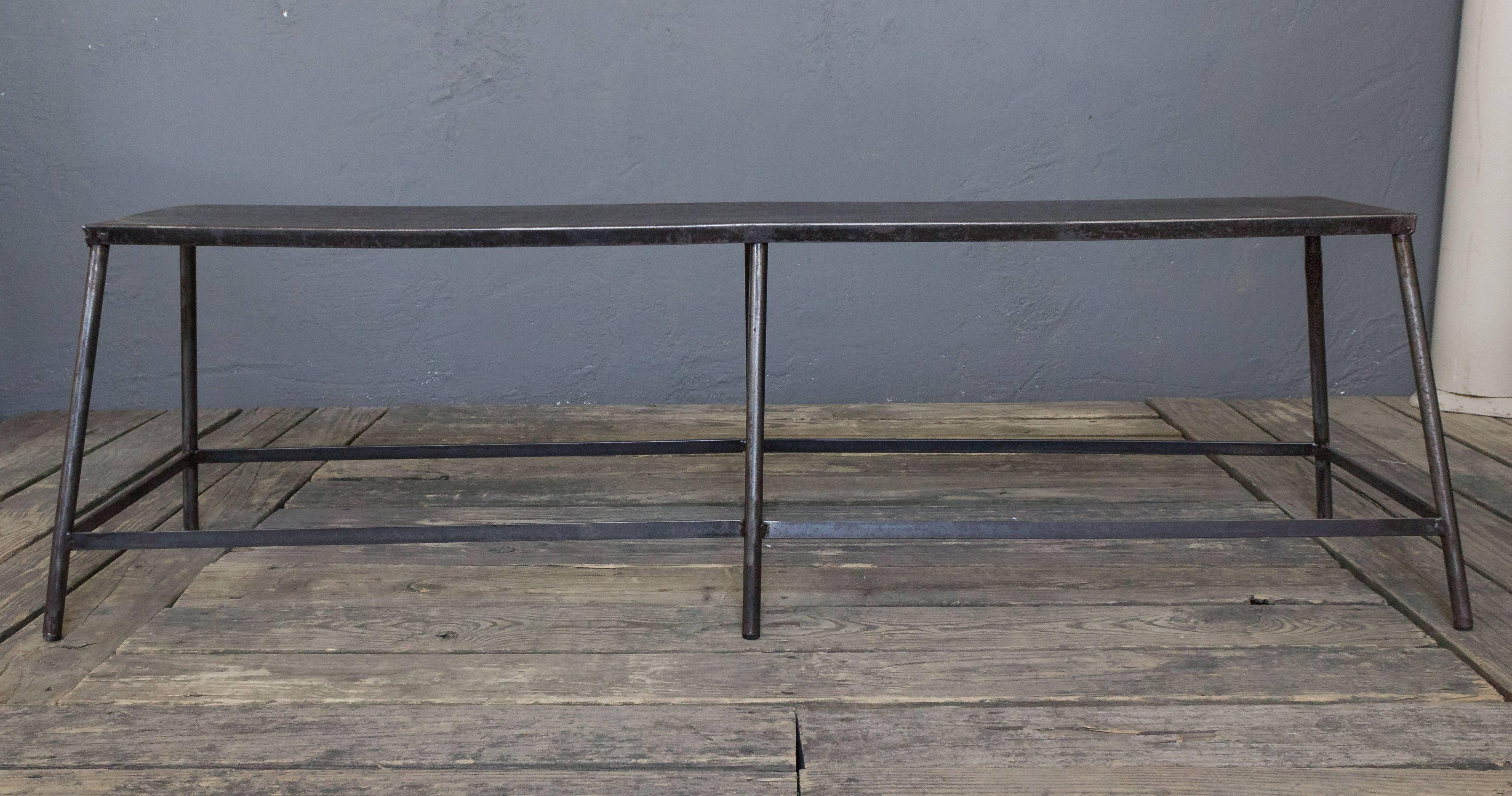 French polished metal industrial bench.. Measures: 18.5" H x 62.5" W x 17.75" D.