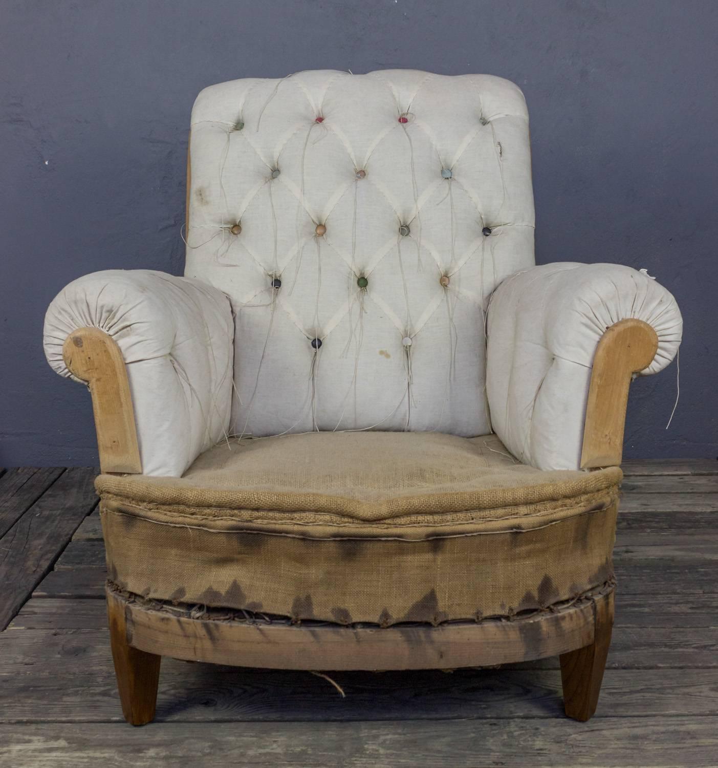 French tufted armchair with matching ottoman. Sold as is, upholstery available, price upon request. 

Ottoman measurements: 23