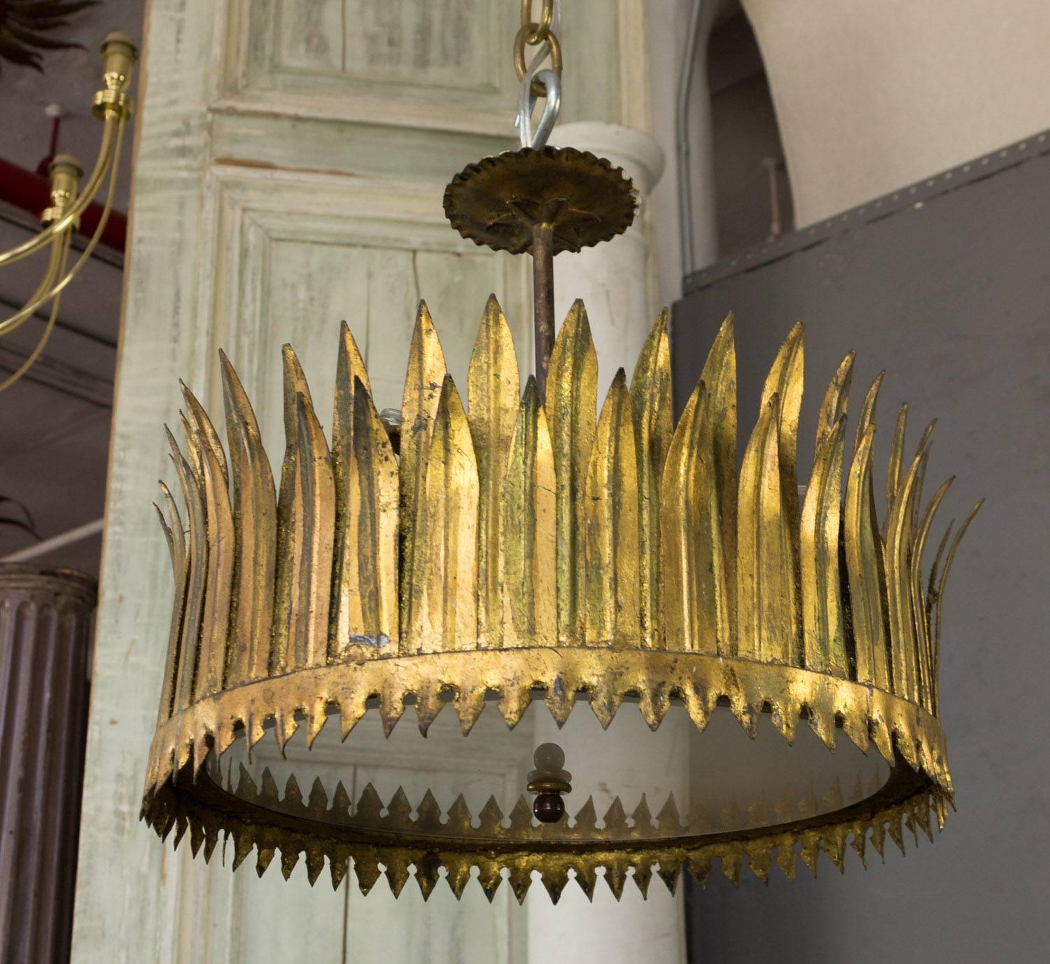 Gilt metal ceiling fixture in the shape of a crown. The glass diffuser is easily removed to make changing the bulbs easy.  This fixture has recently been rewired to accommodate 3 candelabra bulbs and is sold with a matching canopy.  Spanish 1950's