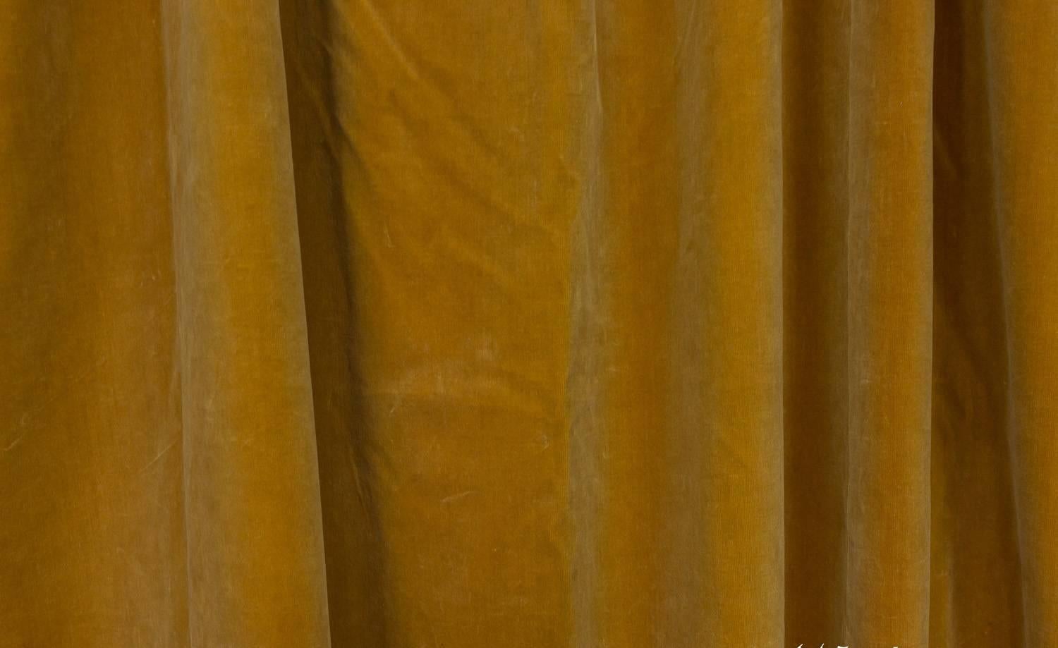 Pair of French gold velvet drapes with ivory cotton lining. Each panel is 56 inches wide at the top for a total of 112 inches.