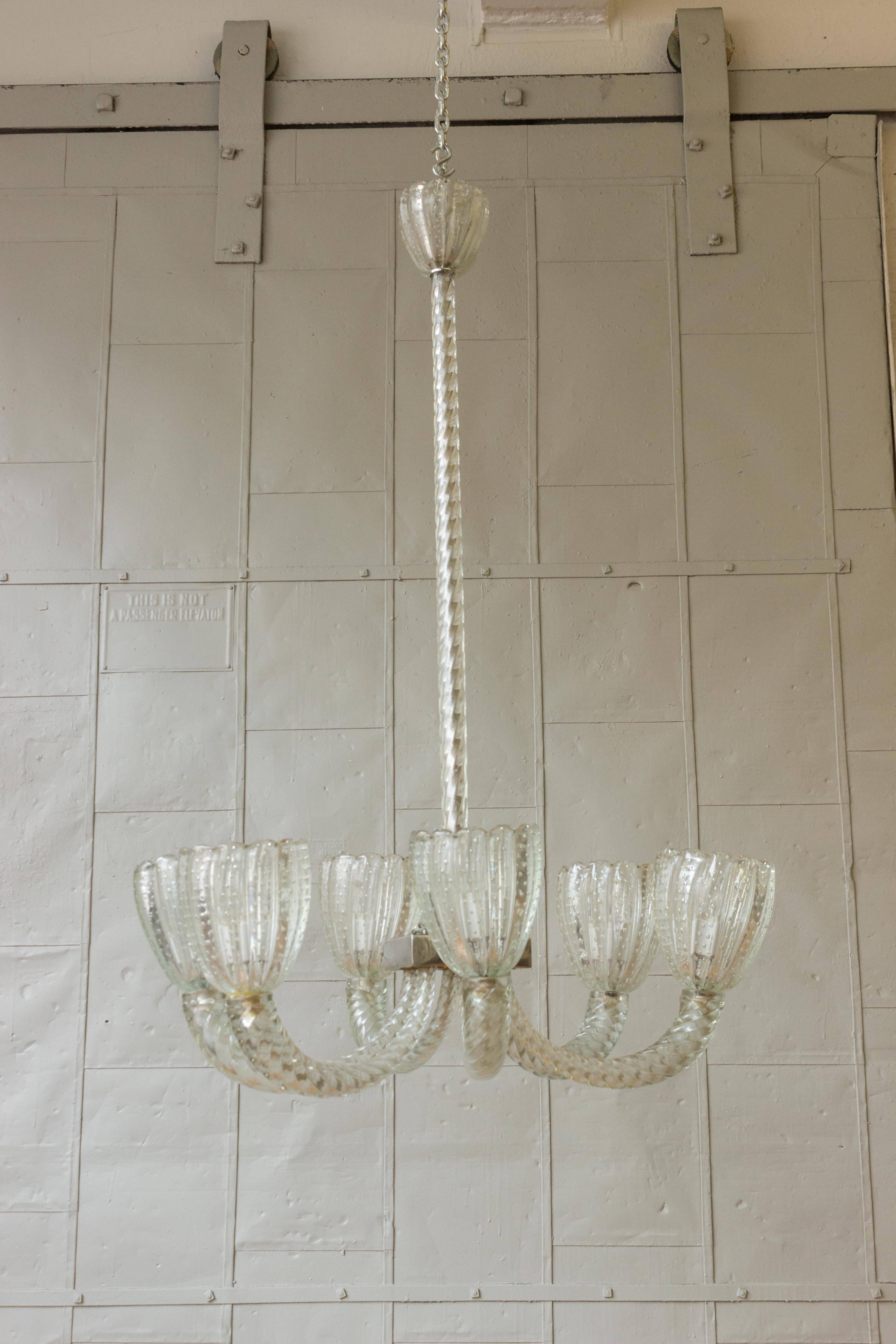 Beautiful clear Murano 1930s six-armed chandelier with nickel-plated centrepiece. The arms are spiraled glass with bubbled designs in the globes.

Not UL Wired, Sold as is. 
