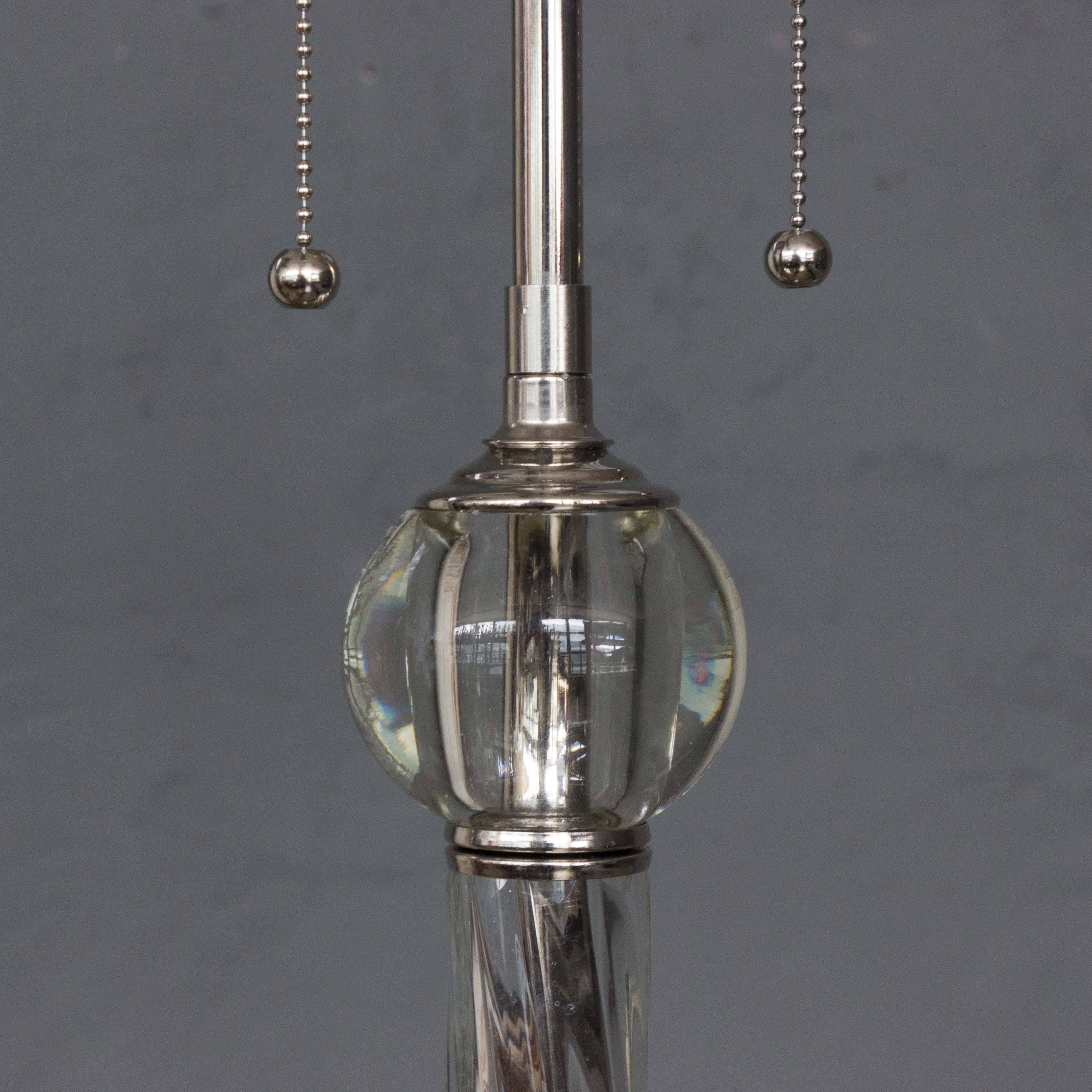 Presenting the timeless elegance of an American Art Deco style glass floor lamp from around 1938. This lamp features meticulous glass and nickel-plated components that seamlessly blend together. The lamp stands at a height of 68 inches, supported by