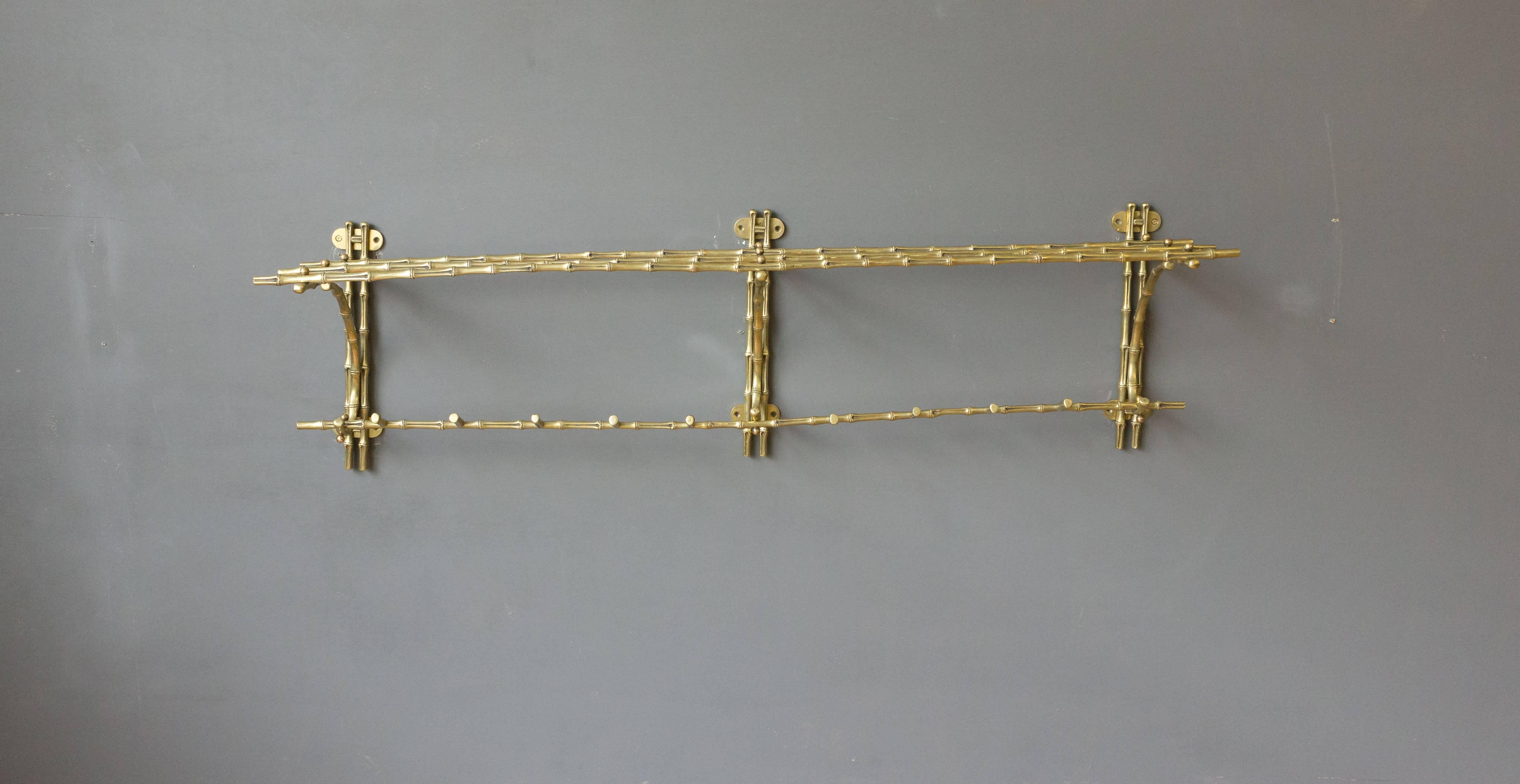 Very good quality faux-bamboo bronze coat rack with large shelf 12 hooks. French. Maison Bagués. circa 1940.