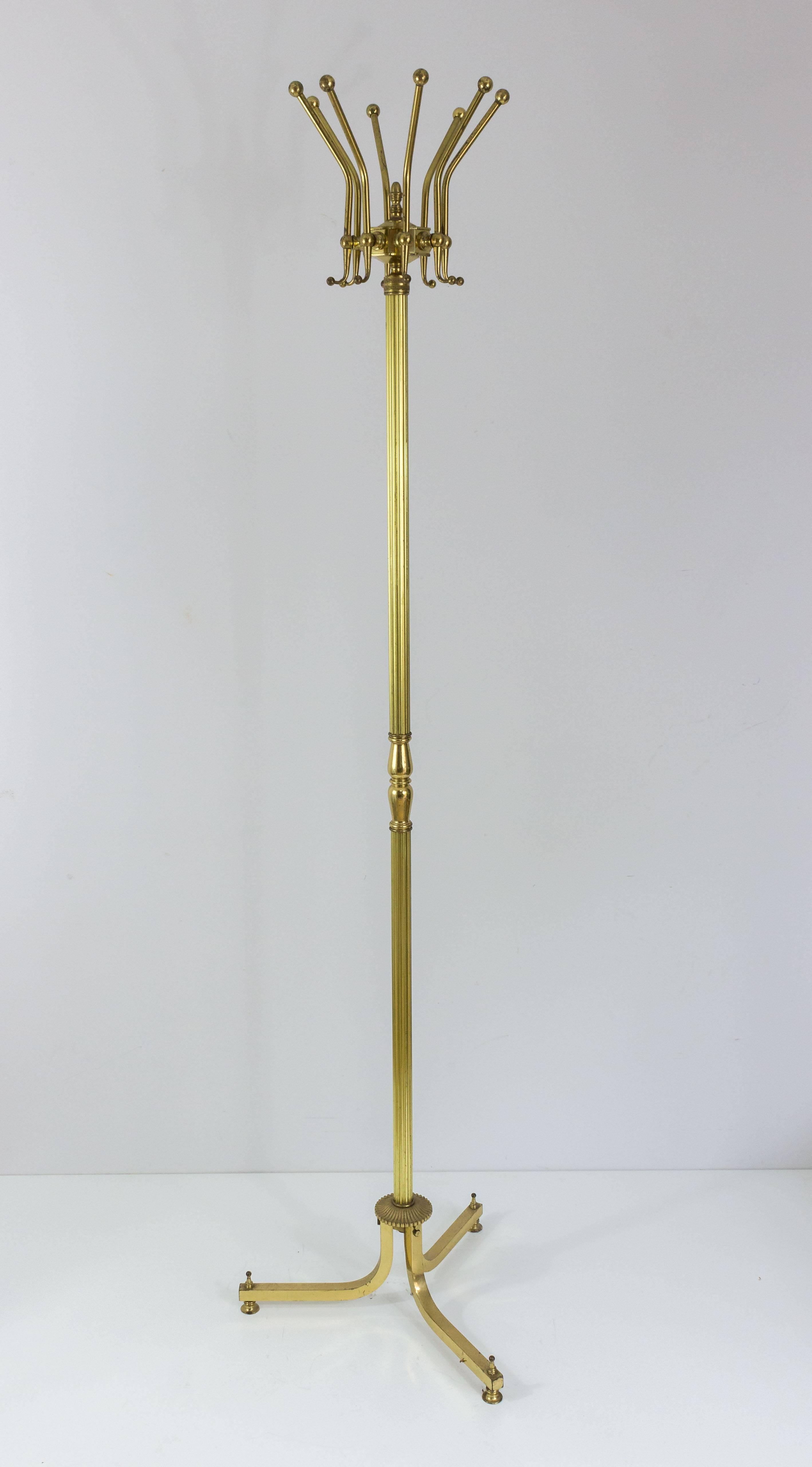 Brass coat rack with that will accommodate 8 coats or hats. French, circa 1940s.

This item is currently in France, please allow 2 to 4 weeks delivery to New York. Shipping costs from France to our warehouse in New York included in price.

