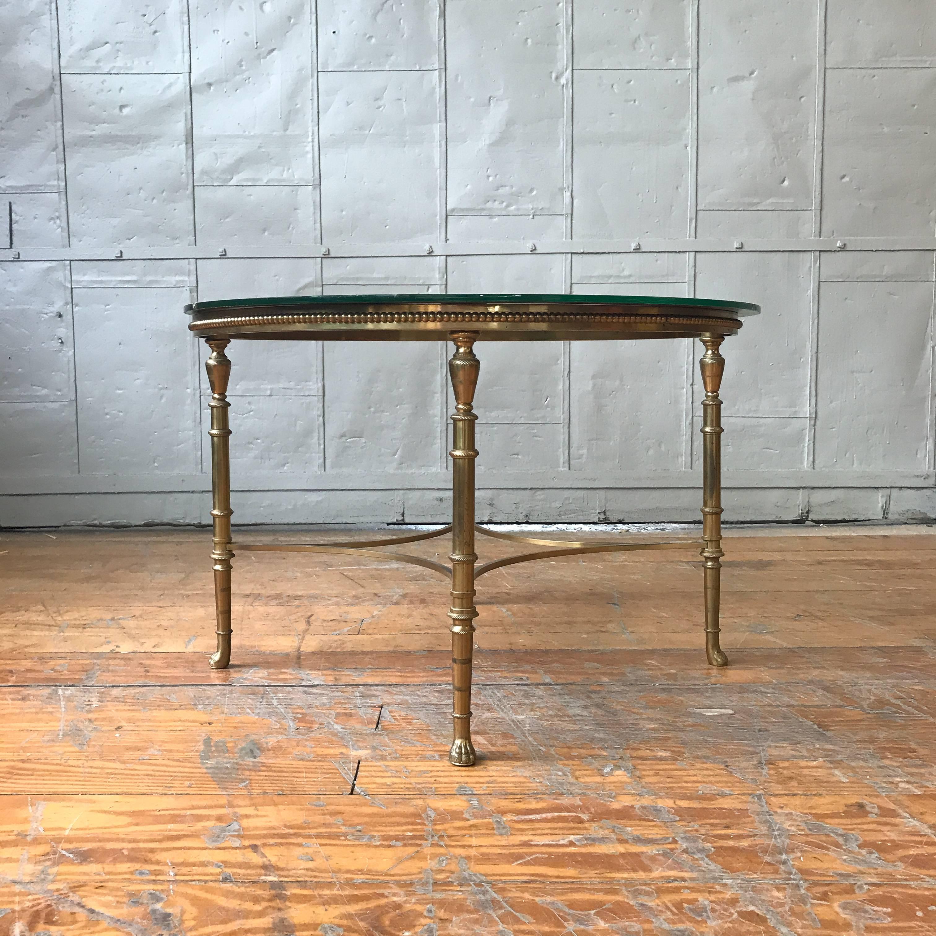 Brass coffee table with an etched glass top.

French, 1940s.


 