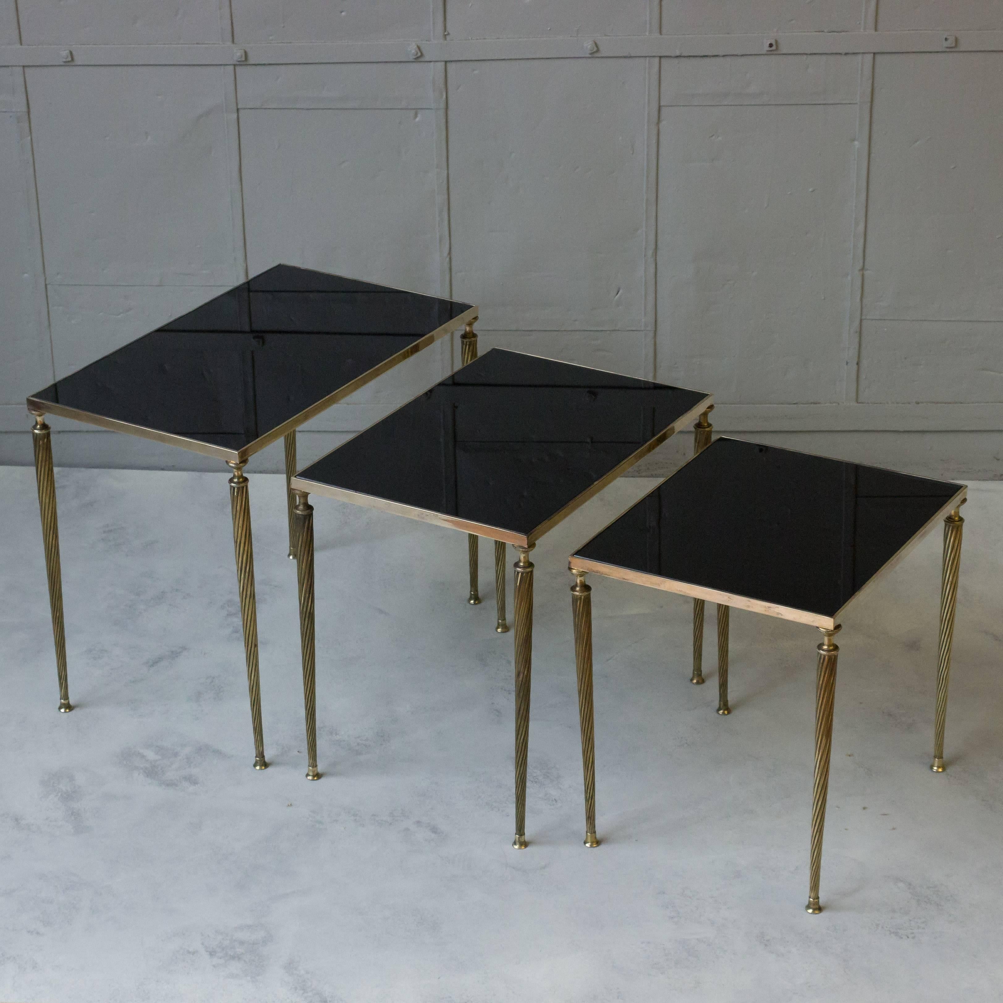Mid-20th Century Set of Black Glass and Brass Nesting Tables in the Style of Maison Jansen