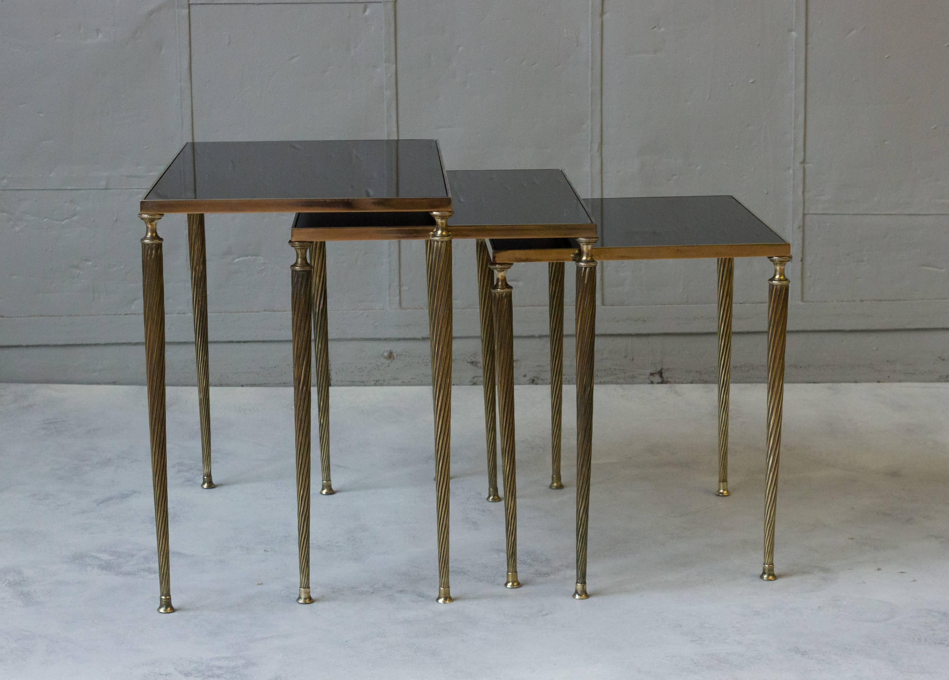French Set of Black Glass and Brass Nesting Tables in the Style of Maison Jansen