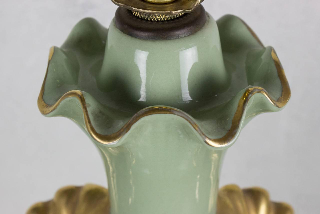 Very elegant American 1920s celadon green porcelain table lamp with Art Nouveau motif with gilt detailing. Very good vintage condition.

Not sold with shade.

Ref #: LT0506-01

Dimensions: 31