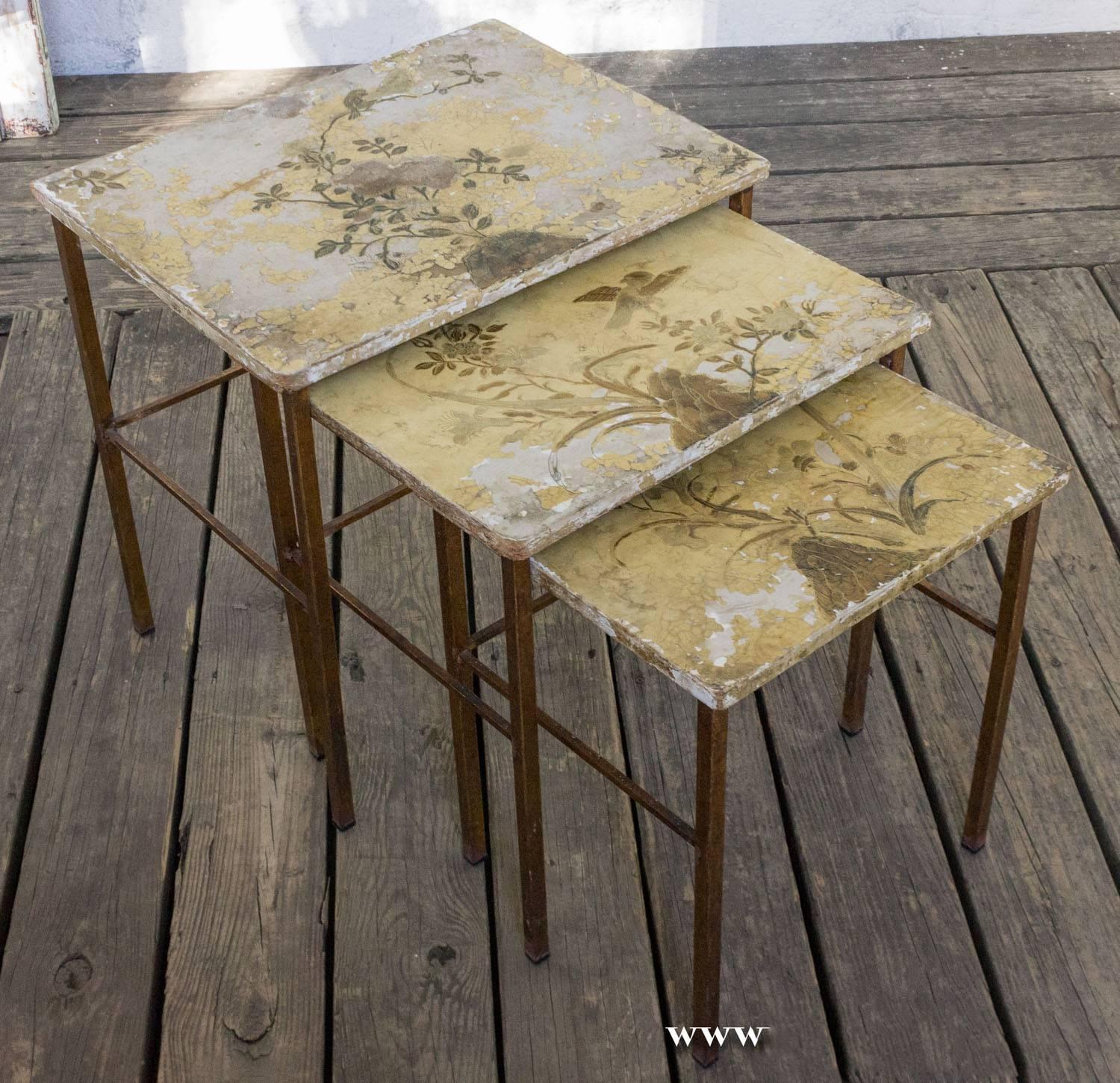 Set of three Spanish, 1950s gilt iron nesting tables with oriental bird and flowers design.