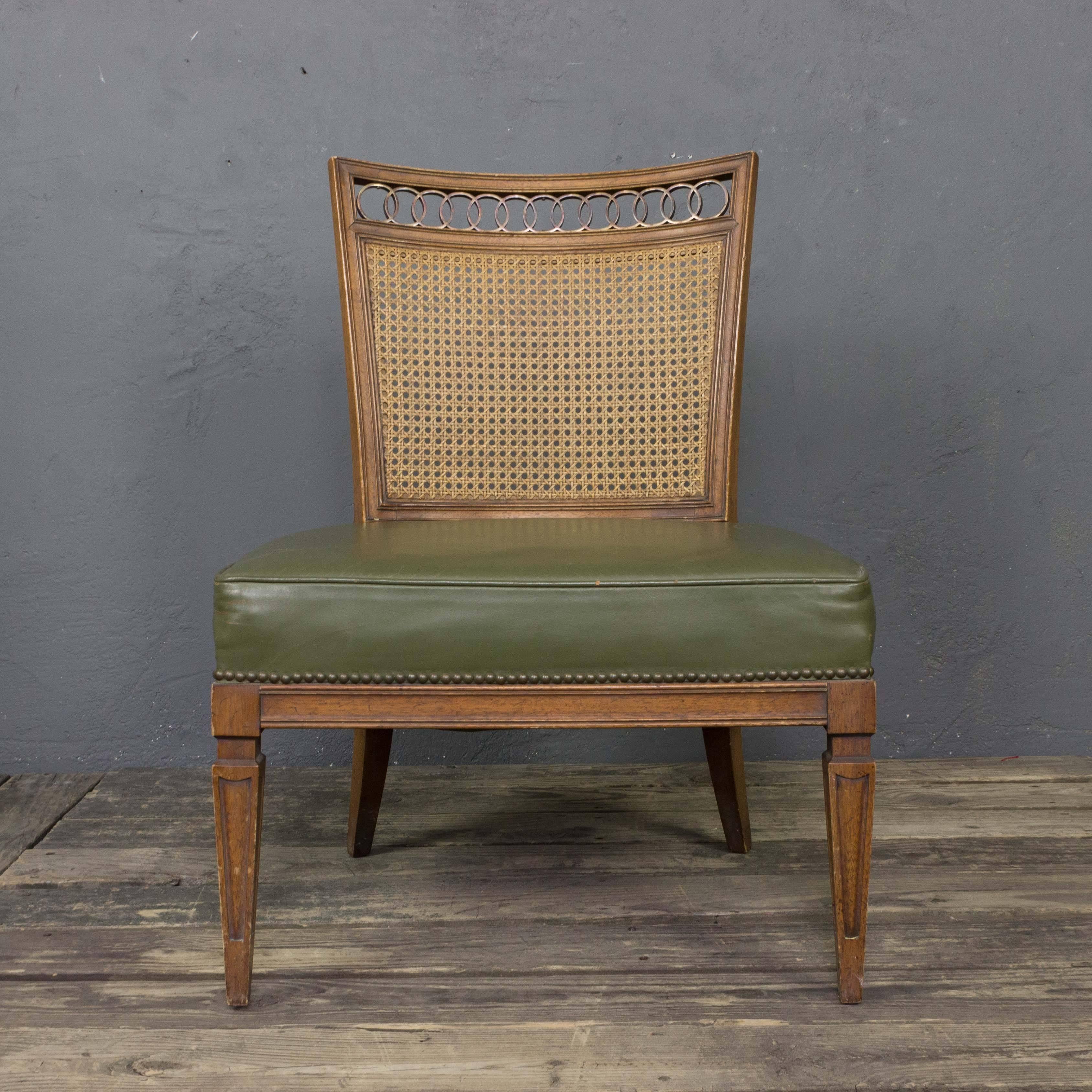 A sophisticated pair of 1950s Italian sidechairs in green leather with wicker backs and brass detailing. Add some classic mid-century modern elegance to your home with this gorgeous pair of 1950s Italian side chairs. Upholstered in green leather,