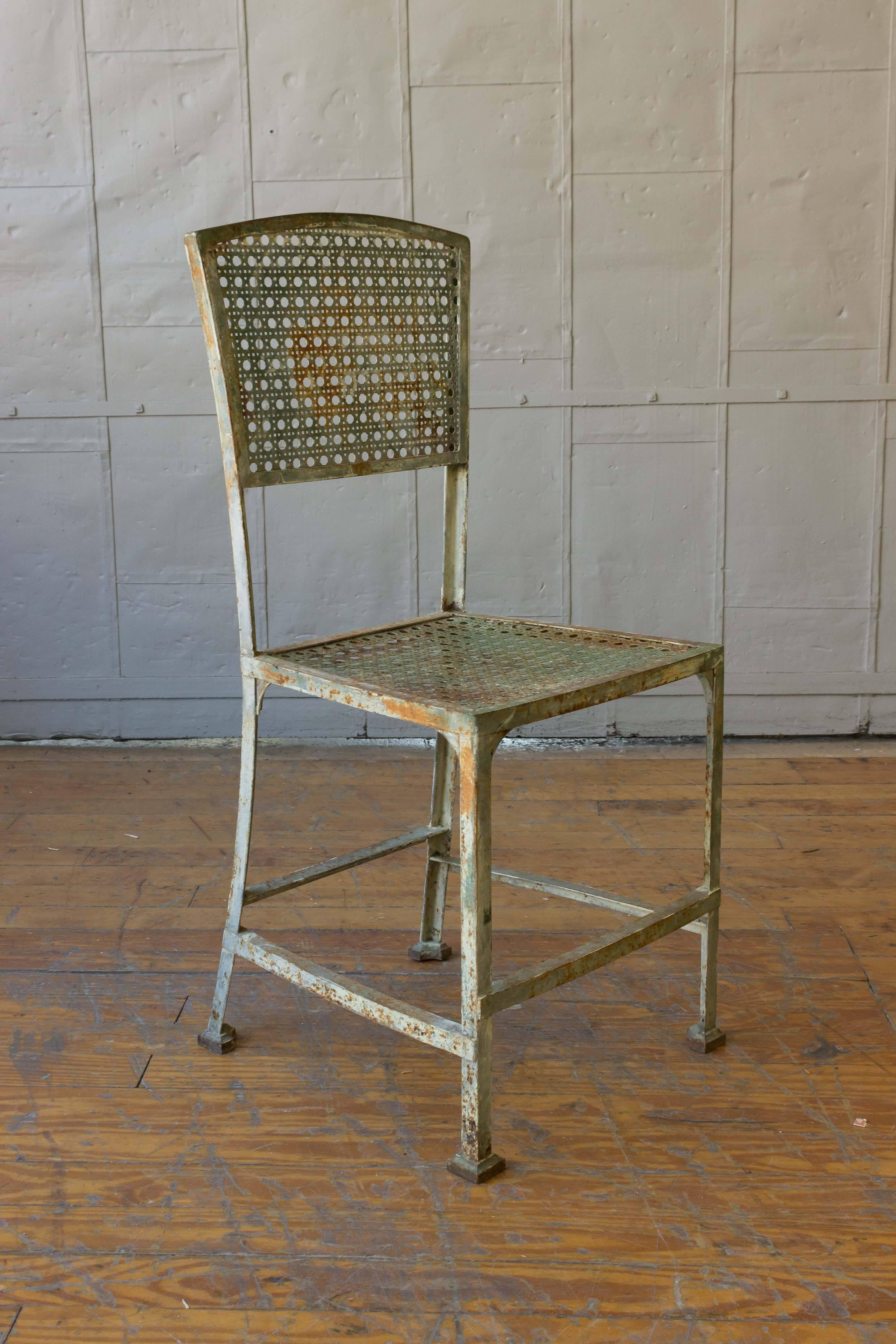 Pair of French iron Industrial chairs with traces of original paint, French, circa 1920.

 