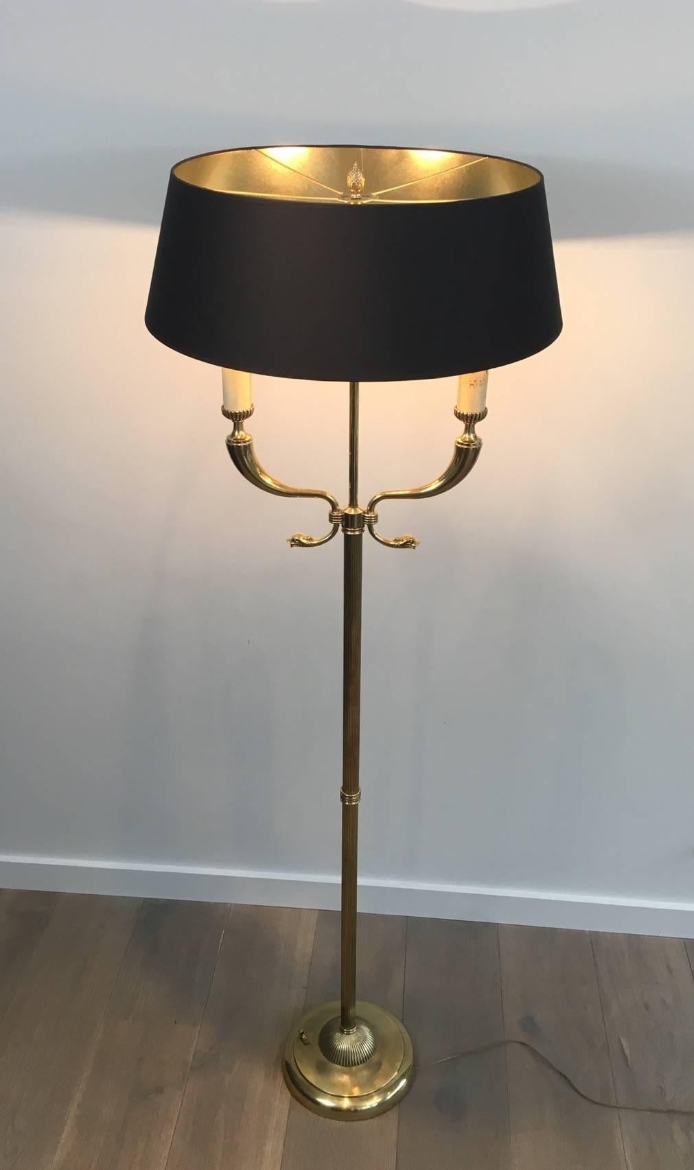 Beautiful brass floor lamp with dolphin heads with double light socket. Attributed to Maison Jansen, French, circa 1940s.

This lamp is currently in France, please allow 4 to 6 weeks for delivery to our warehouse in Long Island City.