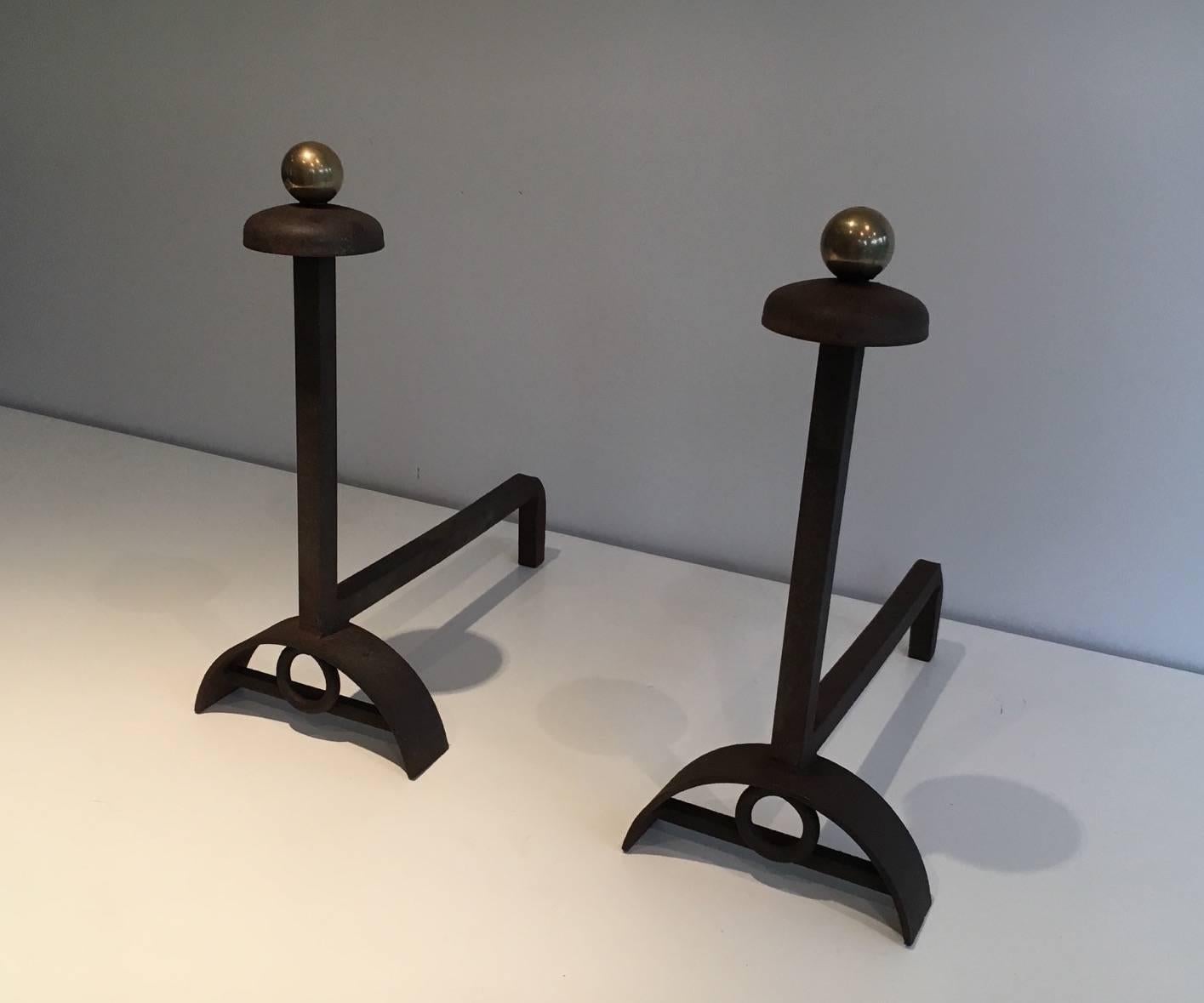 Pair of modernist brushed steel andirons with brass balls. French, circa 1940.

This piece is currently in France, please allow 2 to 4 weeks for delivery. Shipping to our warehouse in New York is included in the price. 
 
