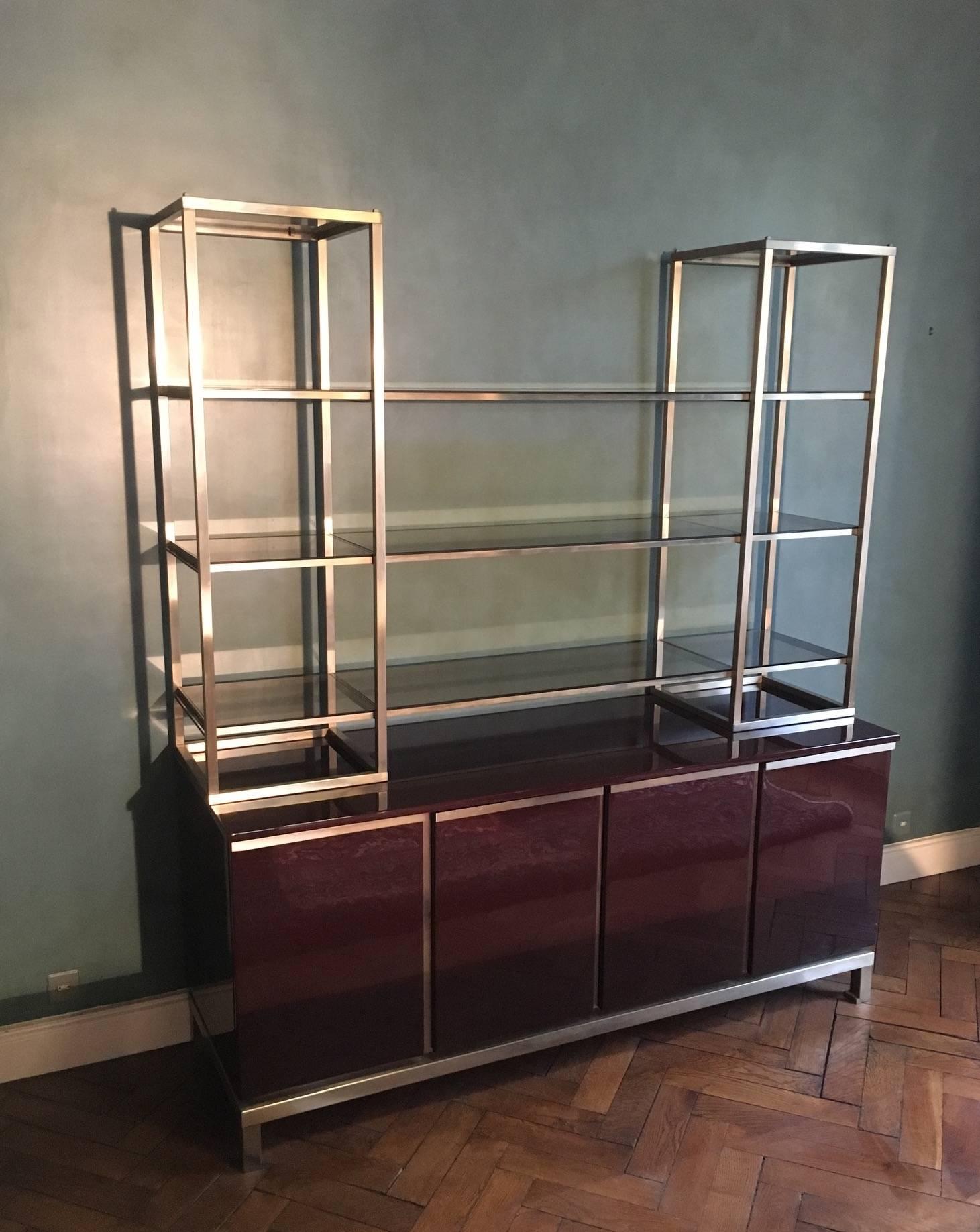 Very rare Guy Lefèvre book shelf made of lacquered wood and brushed steel. 

Also available and sold separately is a matching Guy Lefèvre desk made of leather and lacquered wood and accented with brushed steel, as well as a matching desk chair that