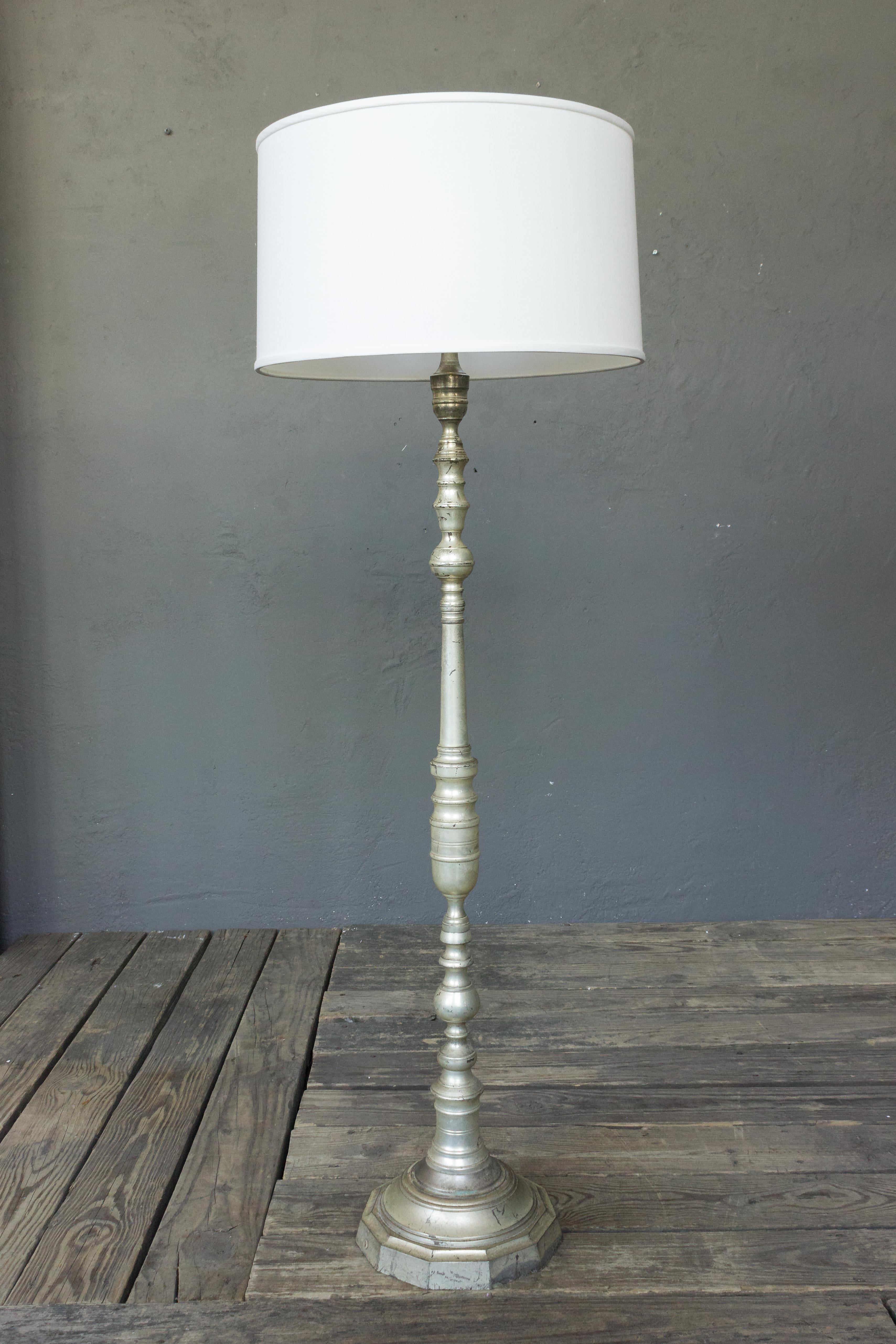 1940s French silvered bronze floor lamp. Price includes hand polishing and new wiring. The plating is original and shows tarnishing and wear. The item is listed in good vintage condition but the plating is not new.

Not sold with shade.

