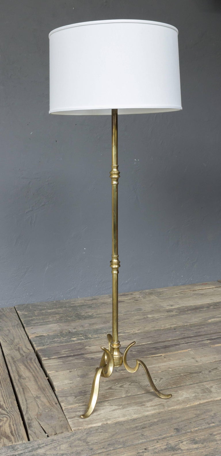 Brass Floor Lamp With A Cast Tripod Base